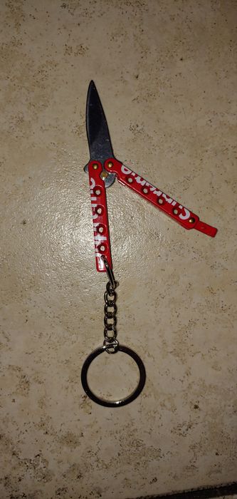 Supreme butterfly knife keychain 2024 red