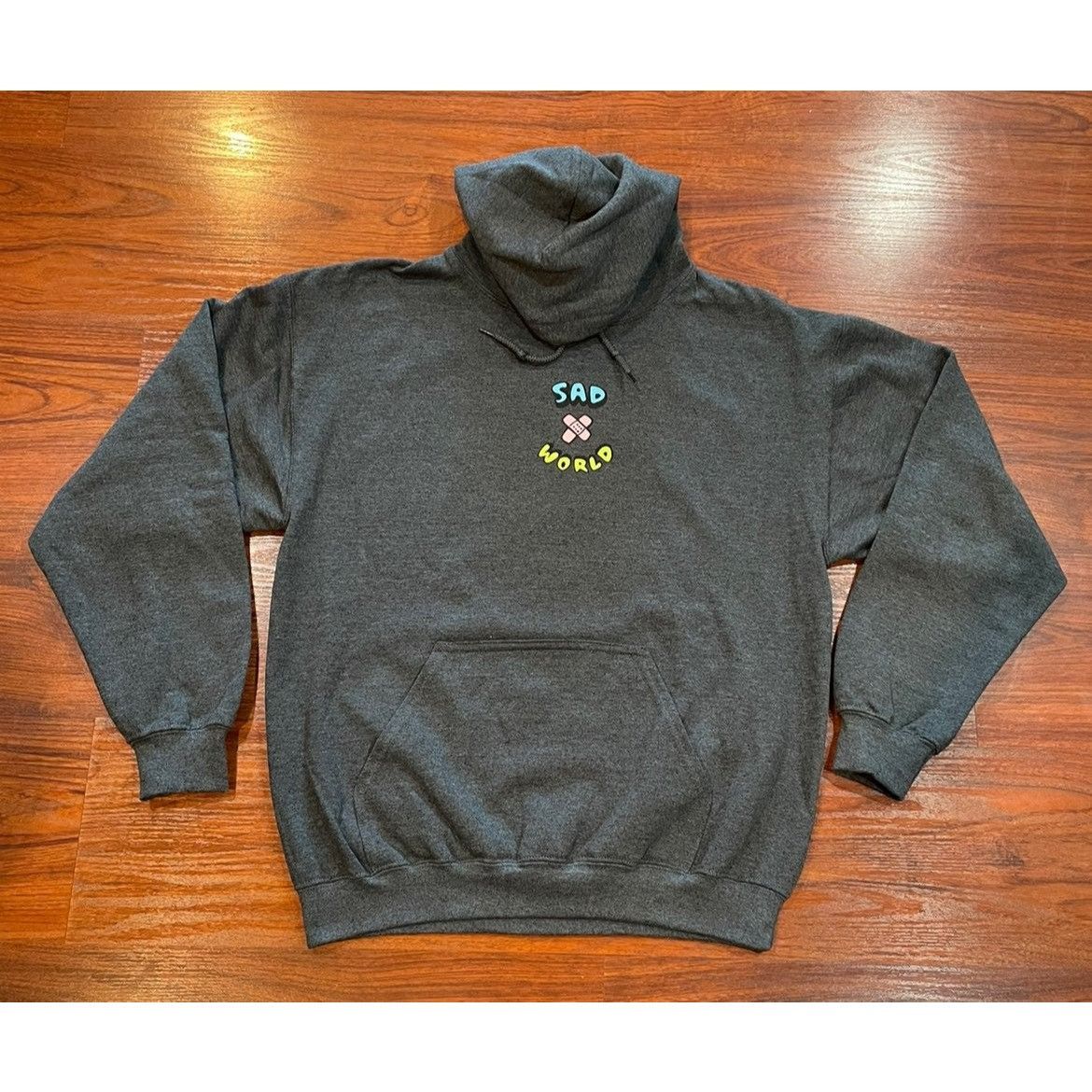 Sad sad world hoodie hotsell