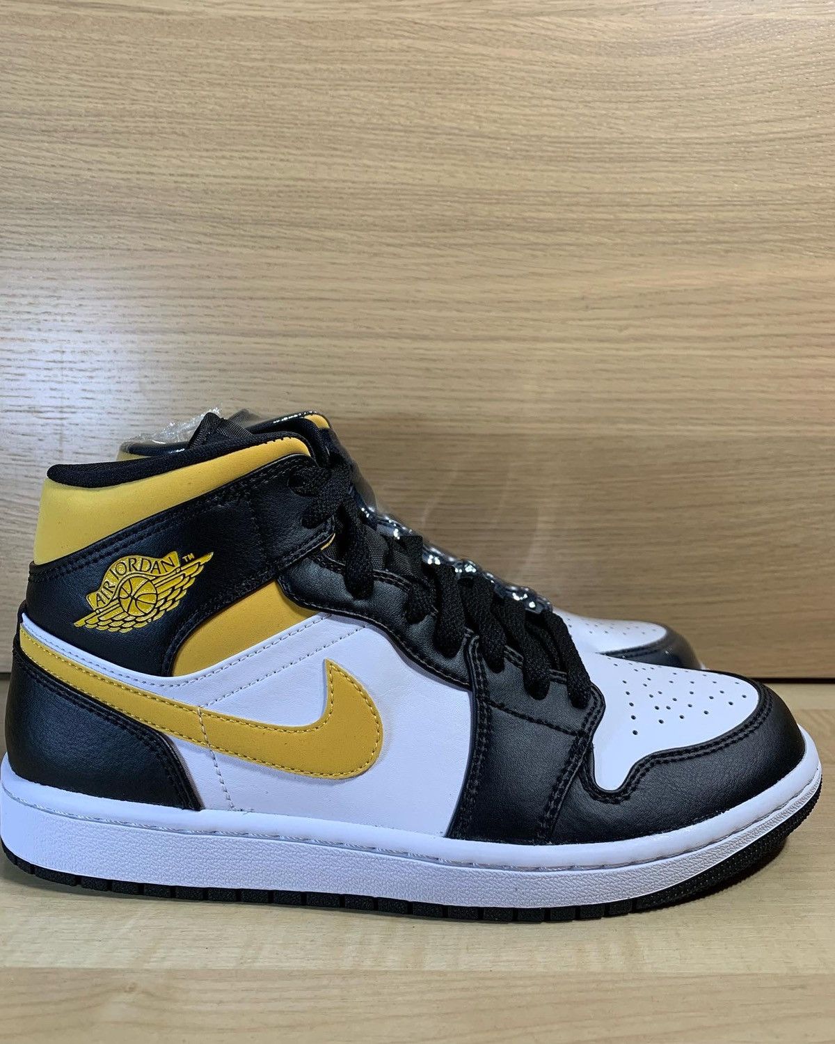 jordan 1 mid pollen stockx