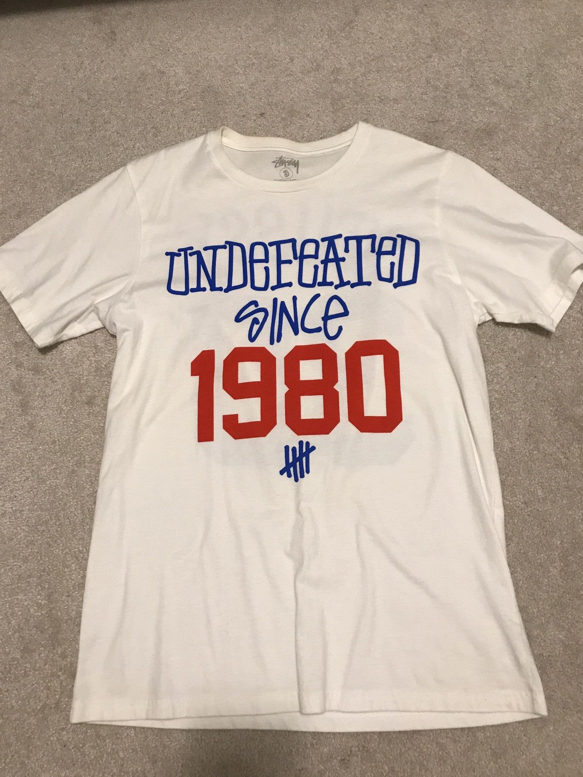 S Undefeated X Stüssy offers Babe Ruth Tee