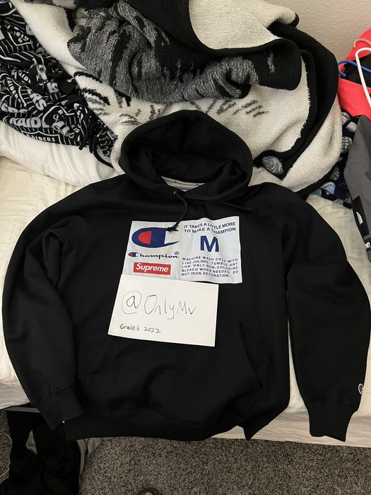 Supreme champion label on sale hoodie