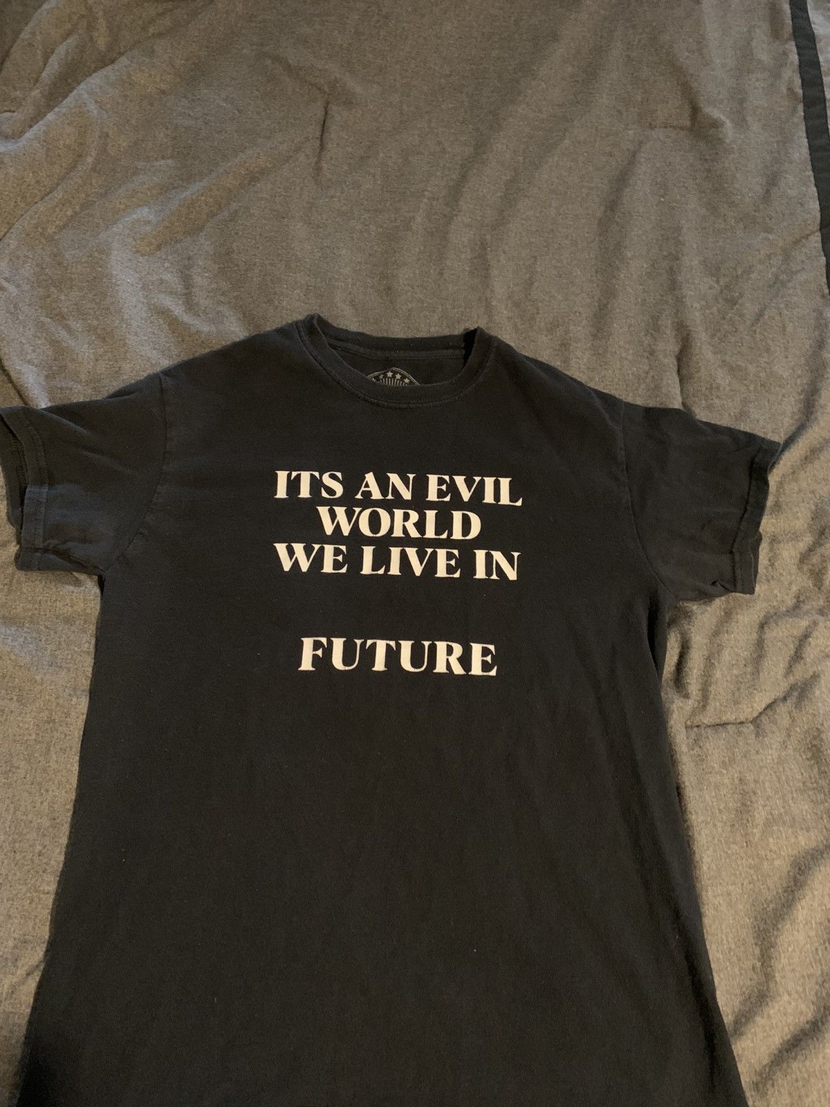 Streetwear ITS AN EVIL WORLD WE LIVE IN TEE | Grailed