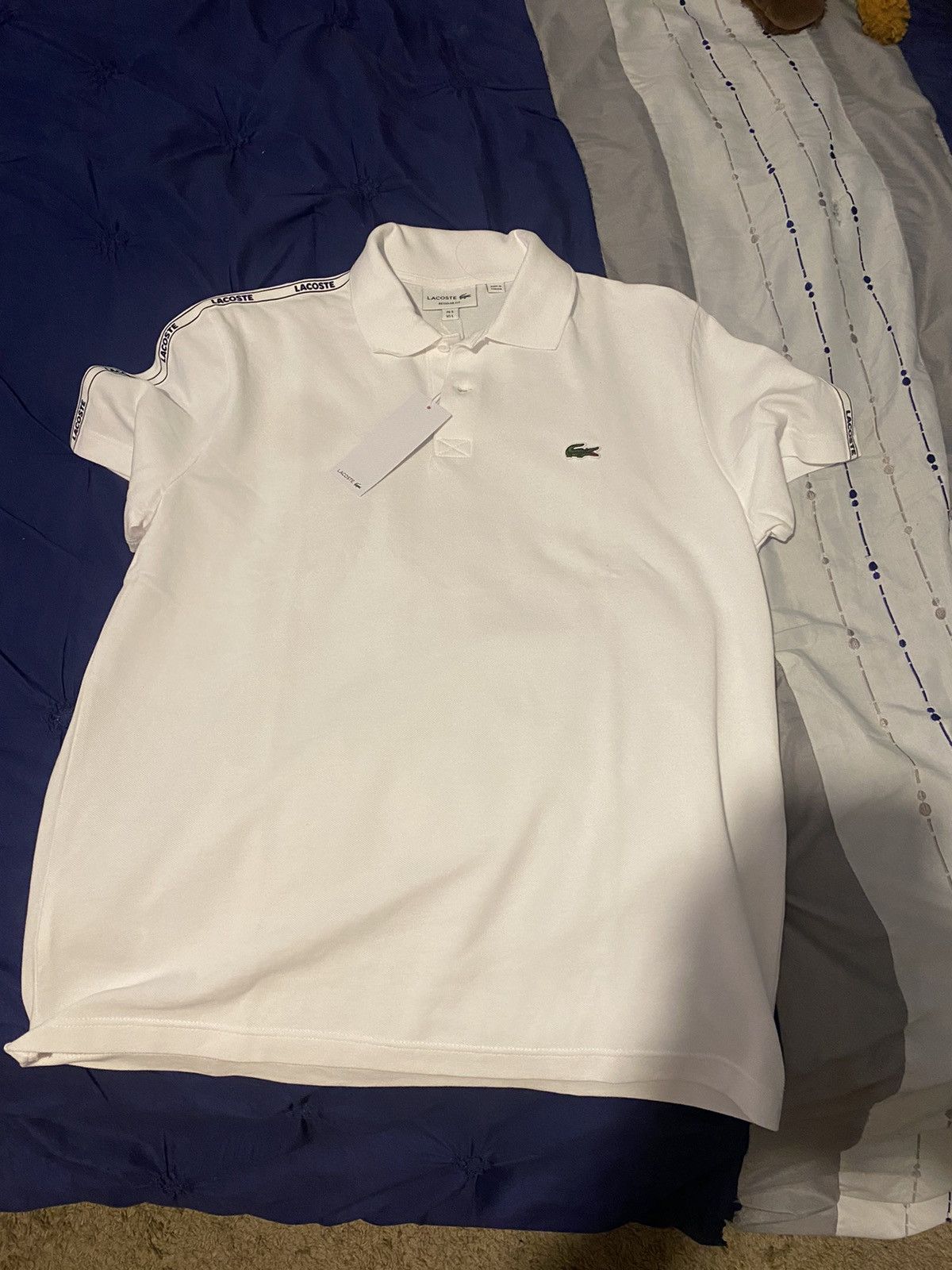 White Lacoste polo