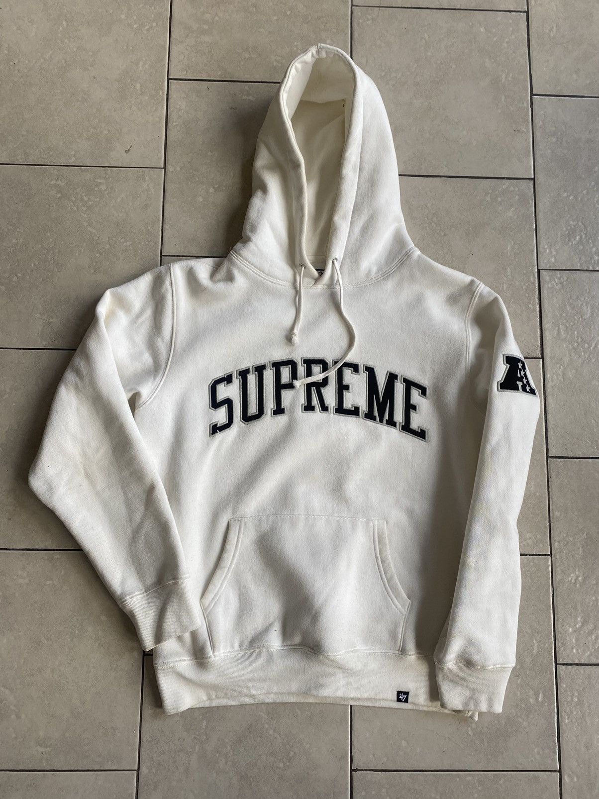 Supreme raiders hoodie white hot sale