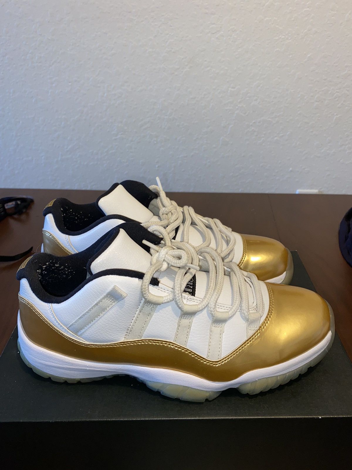 low top jordan 11 gold