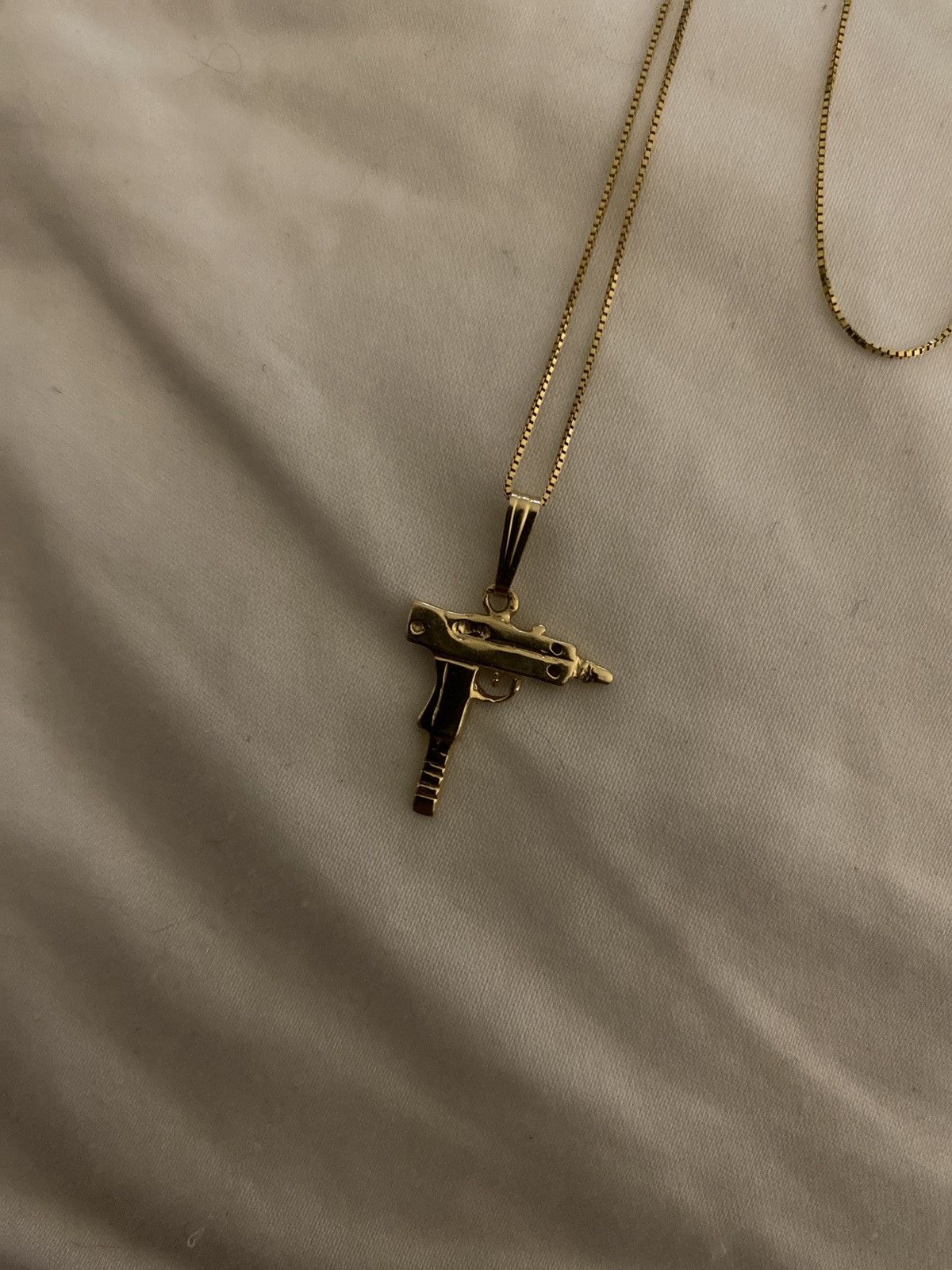 Supreme uzi necklace store