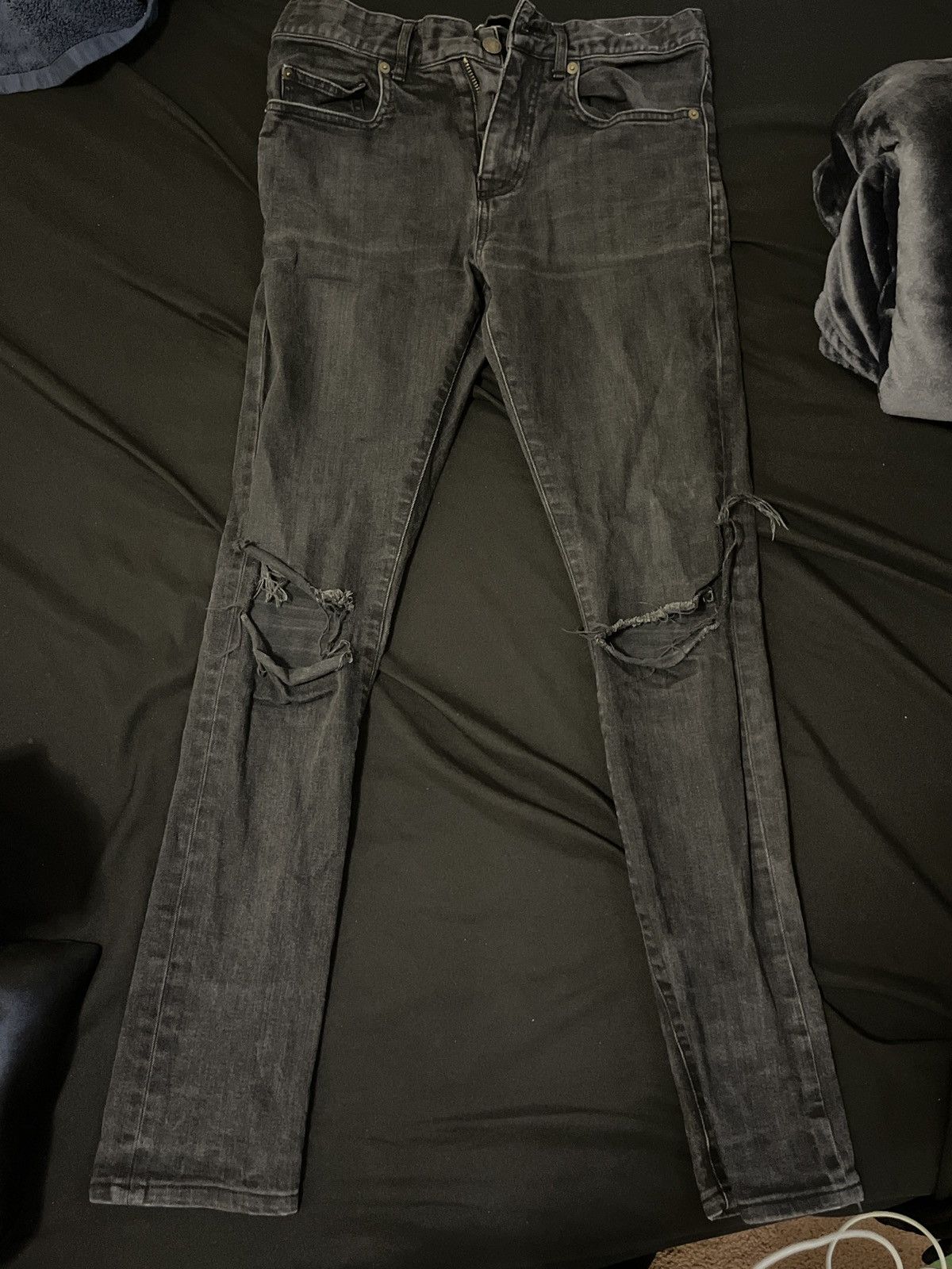 YSL skinny ripped jeans