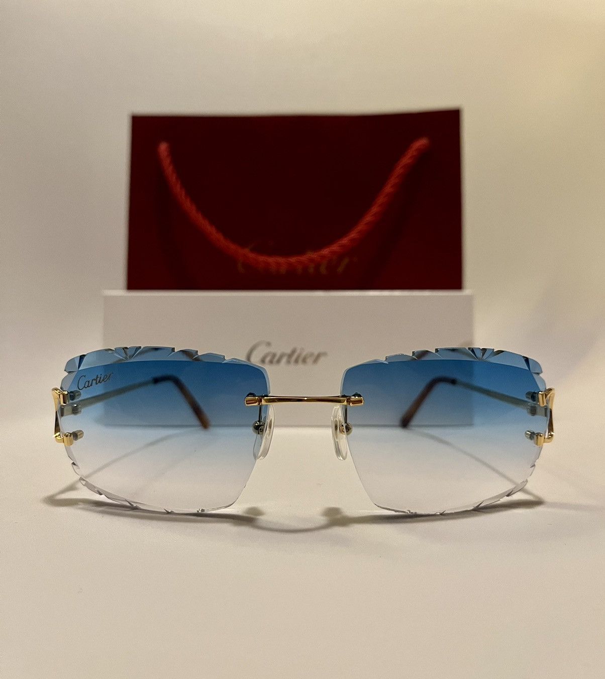 Cartier Cartier rimless Diamond cut Sky blue sunglasse BIG C CT00920