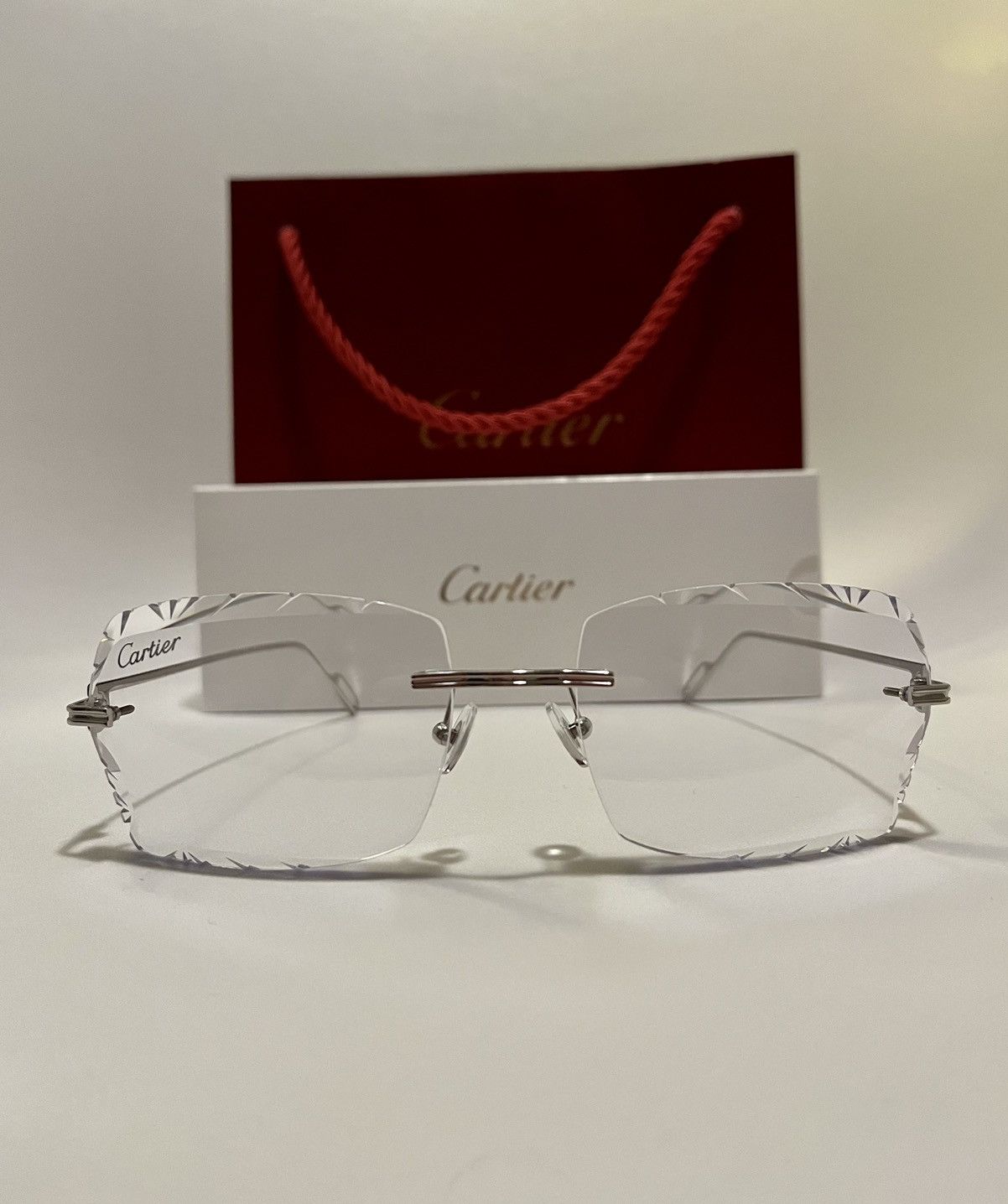 Cartier rimless Premiere Diamond Cut Clear C decor CT0162O