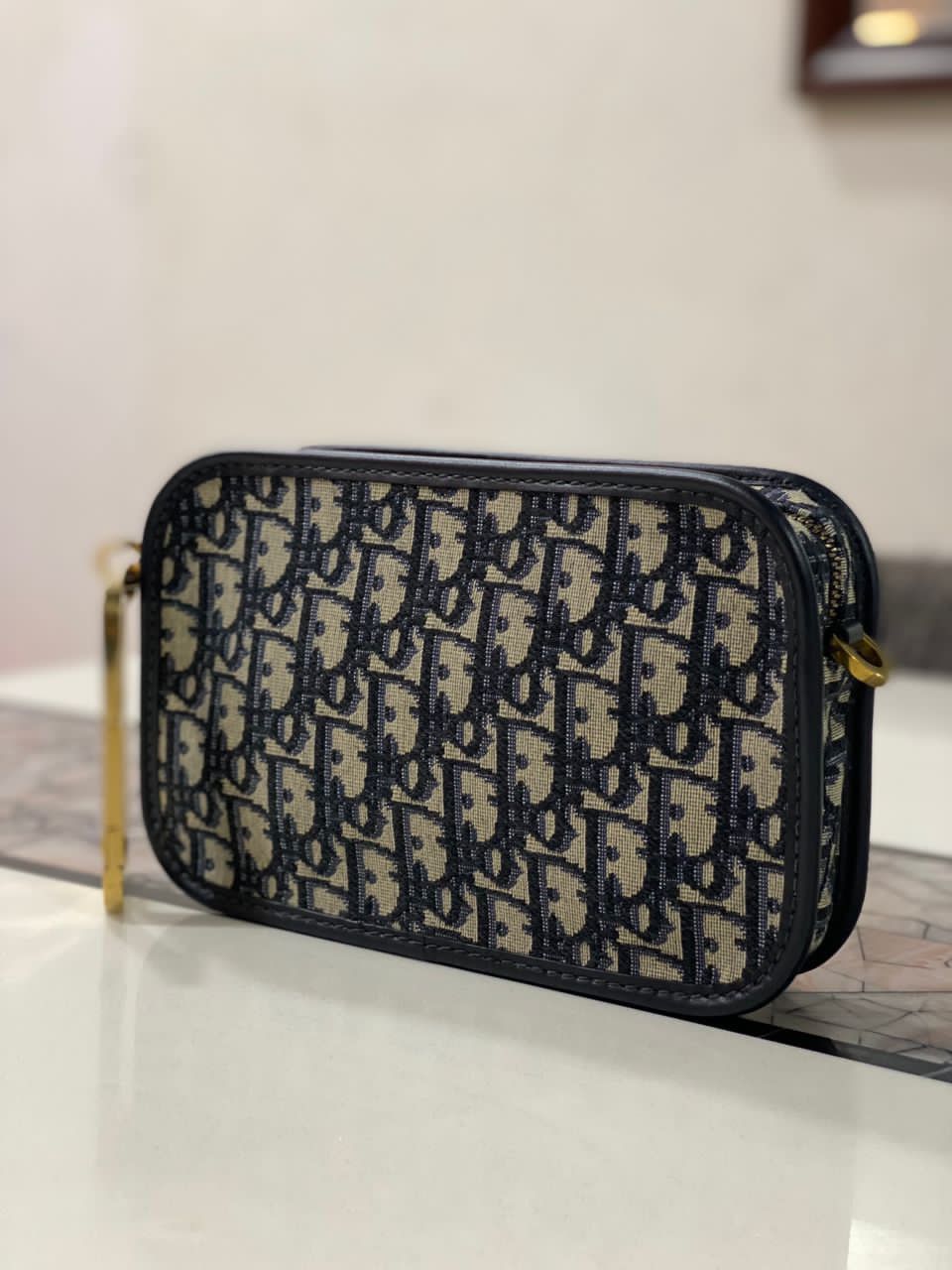 Dior oblique canvas diorquake clutch bag hotsell