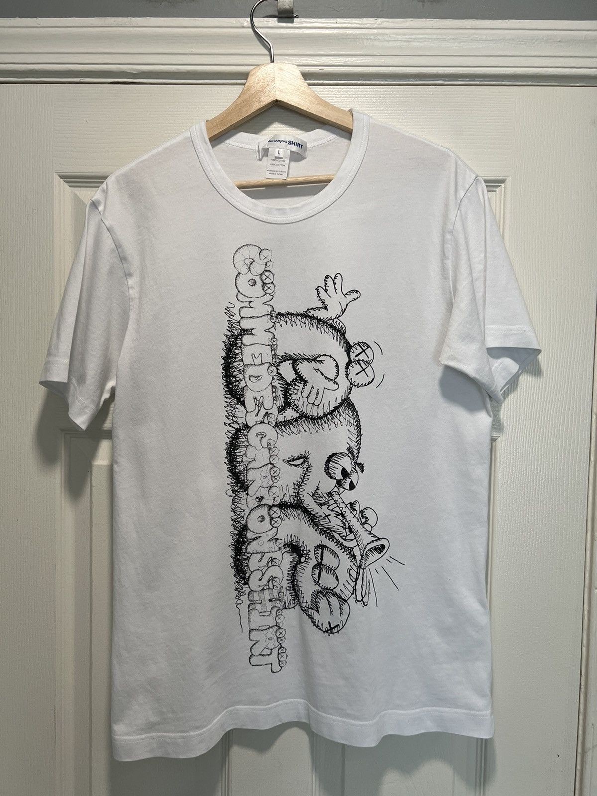 Comme des Garcons CDG X KAWS bubble letter tee | Grailed