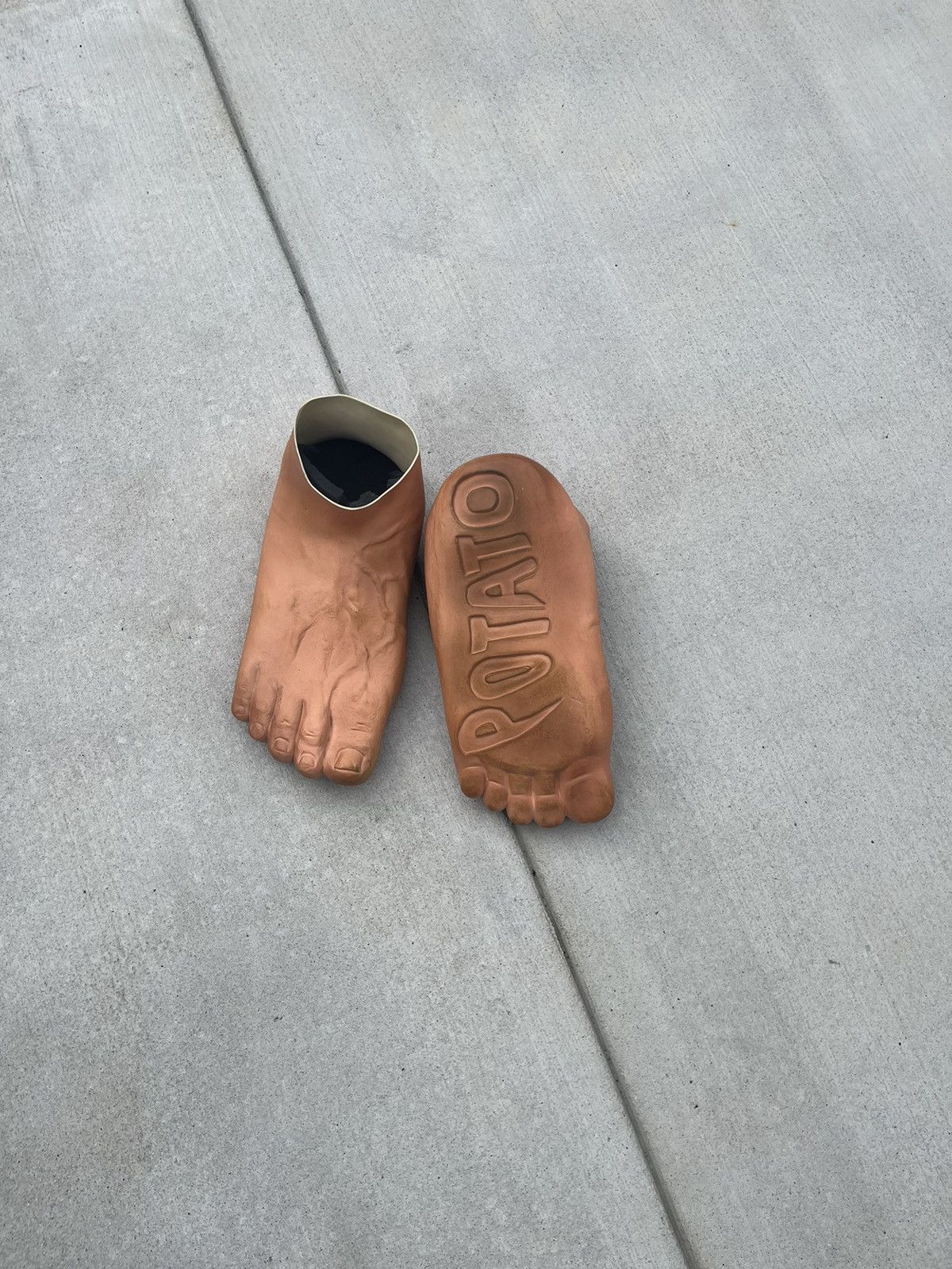 The holy grail of footwear. The Imran Potato Caveman Slippers. :  r/ofcoursethatsathing