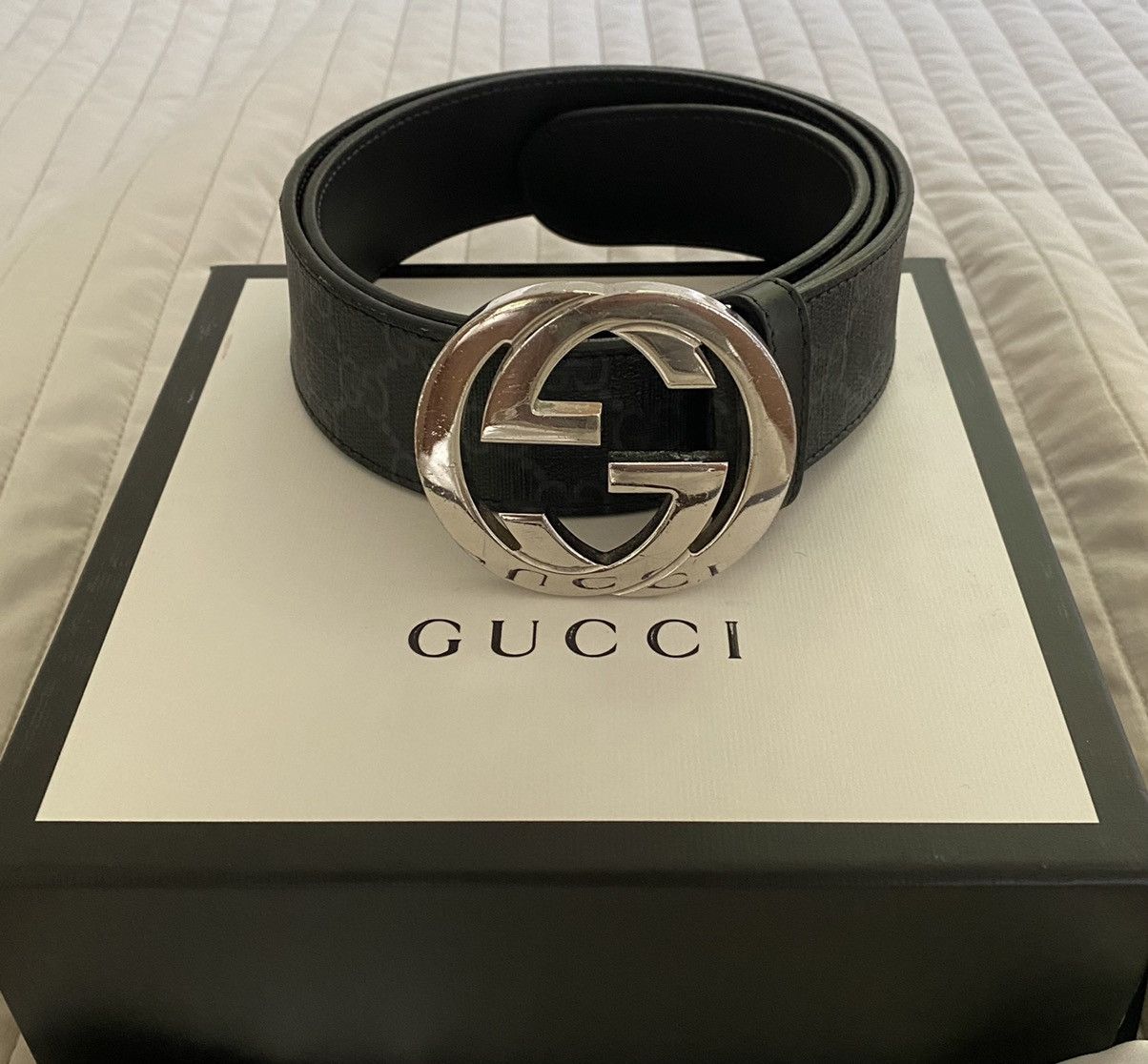 Gucci silver logo buckle monogram black leather belt.