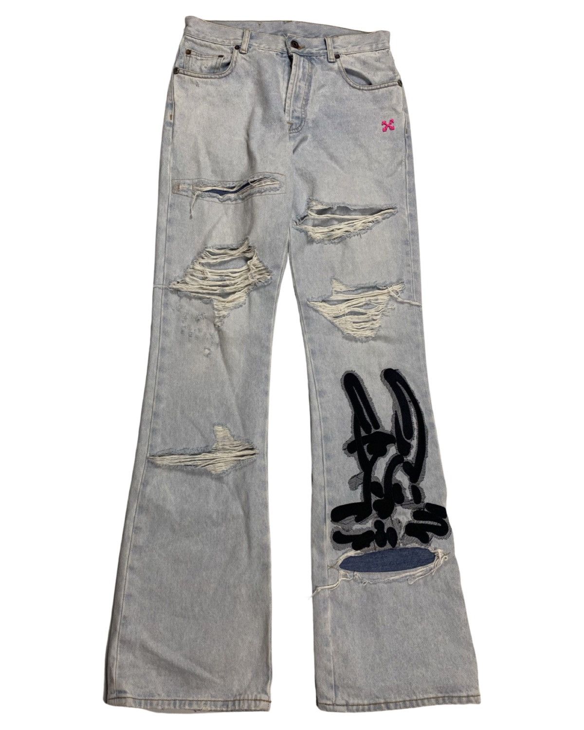 Flared distressed / ripped bleached jeans light blue