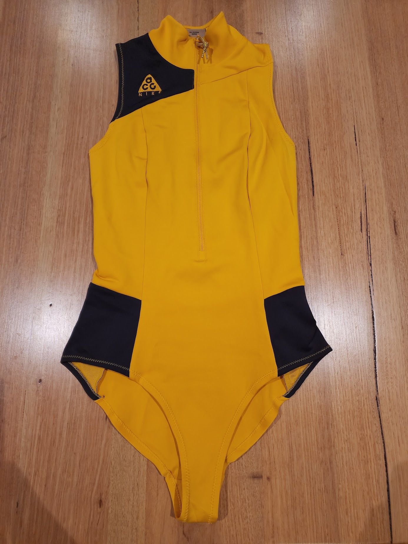 Nike bodysuit yellow online