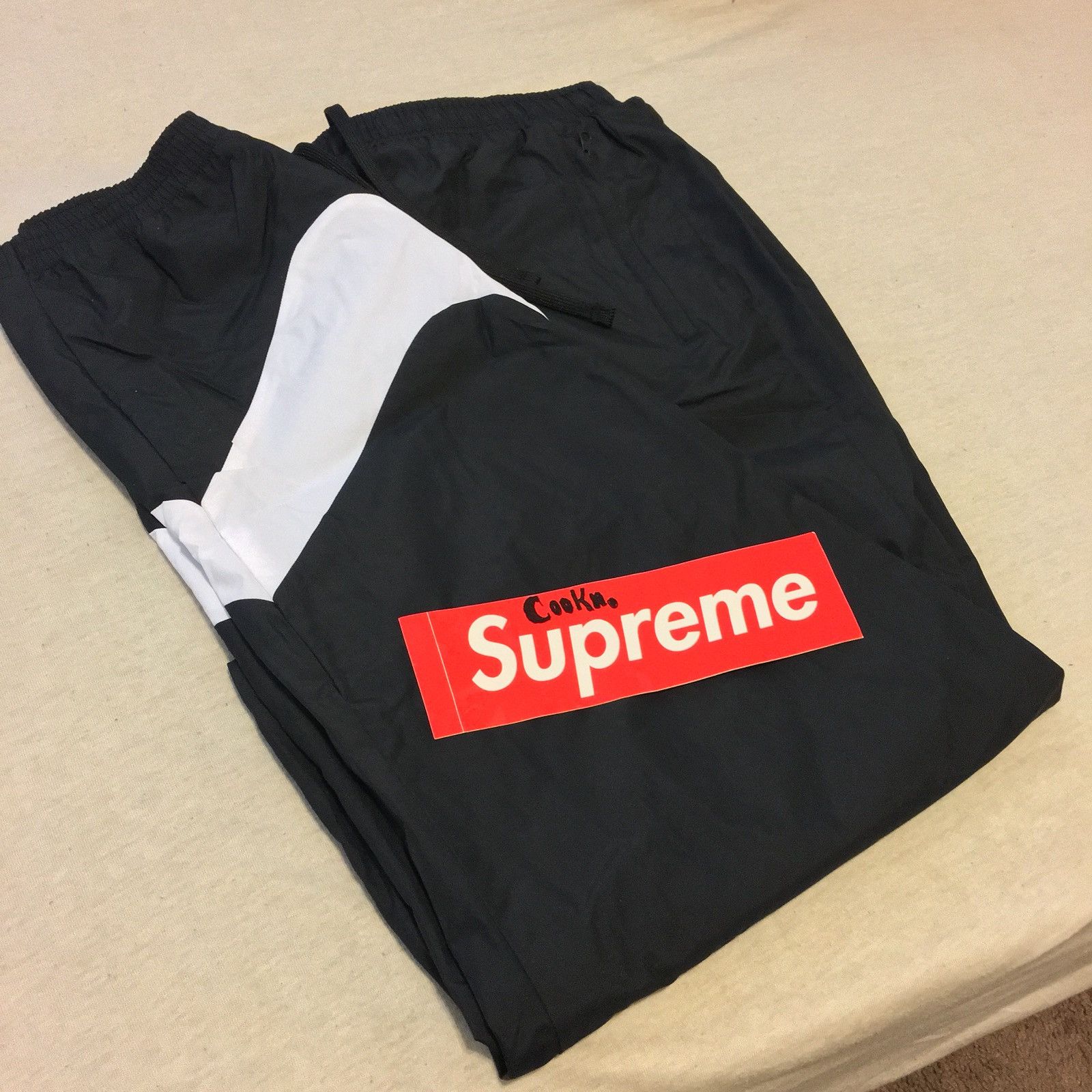 kith nike big swoosh pants