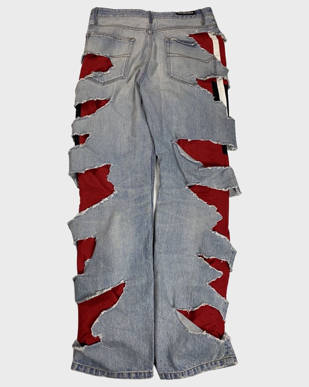 Balenciaga Slashed jeans in blue with red sporty b