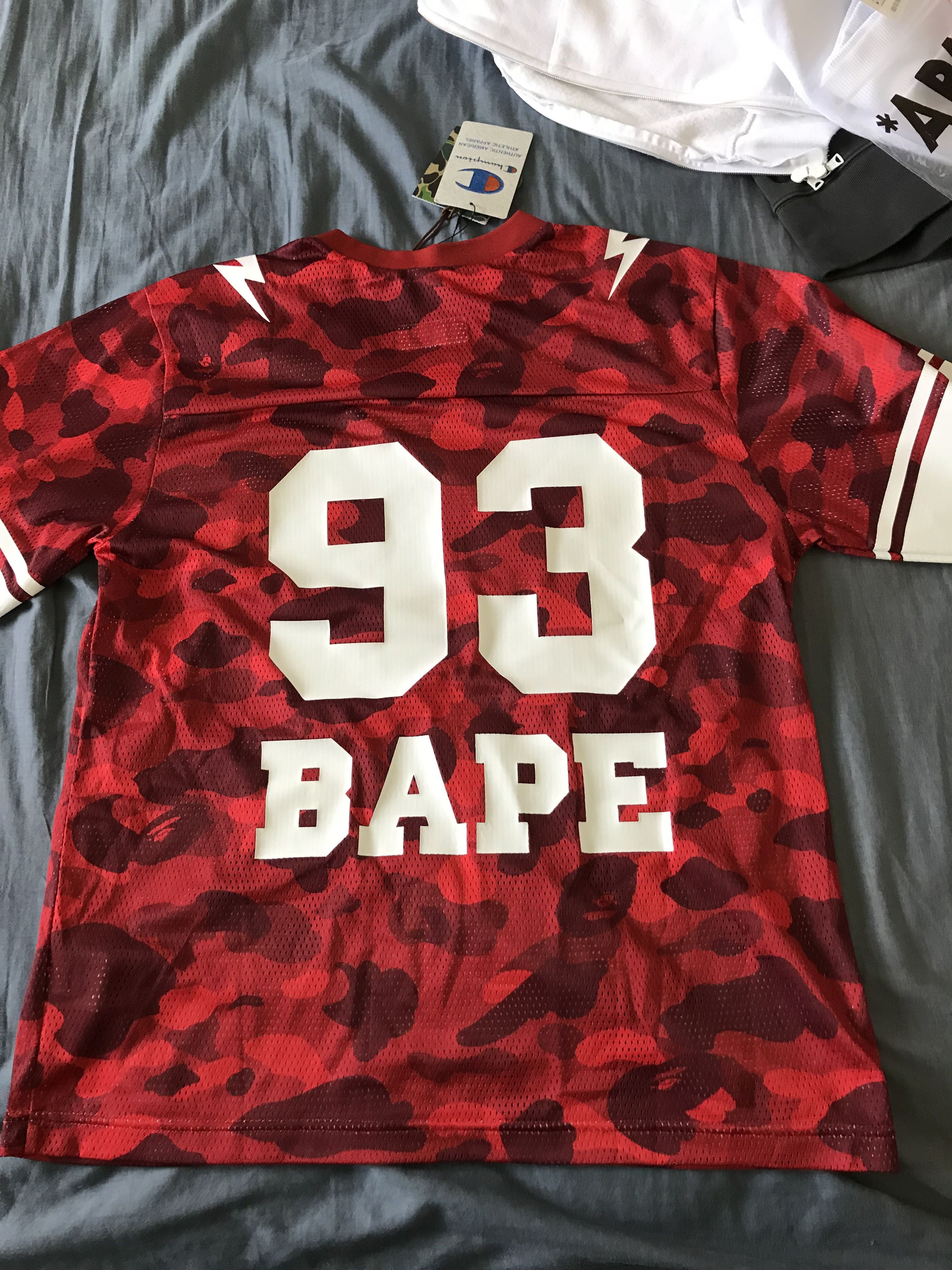 Bape Champion Bape x champion red first camo football jersey Grailed