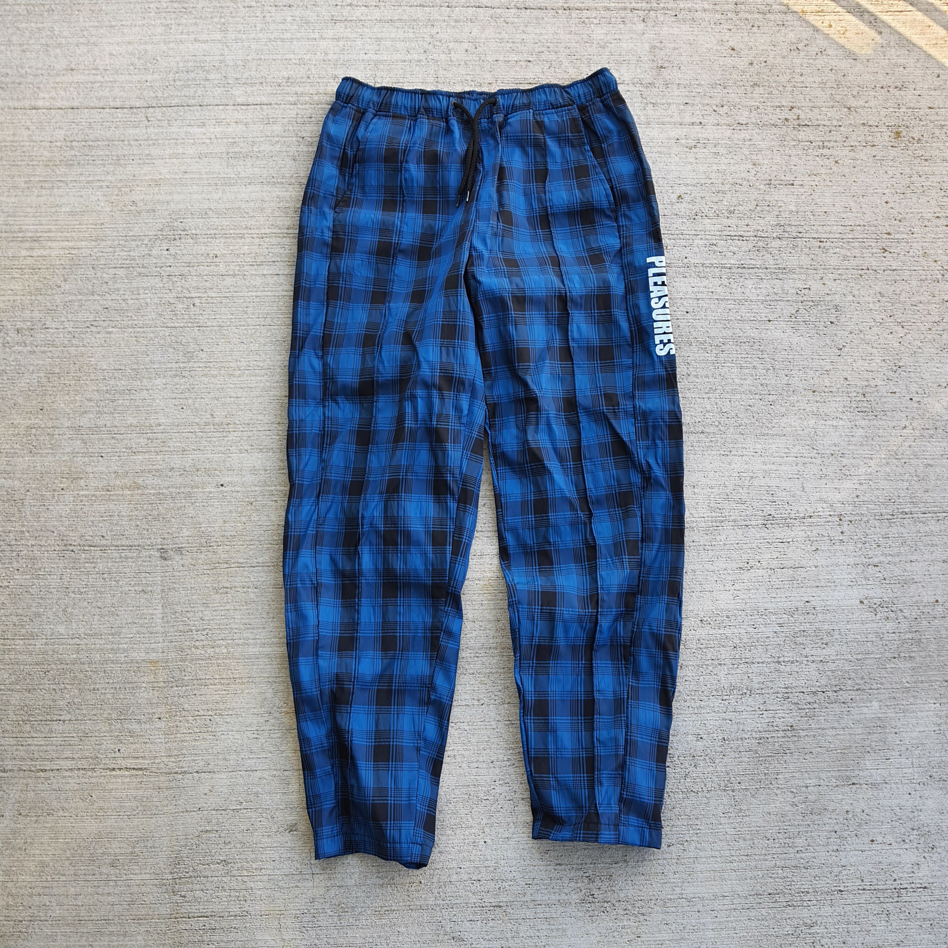 Blue plaid track pants on sale