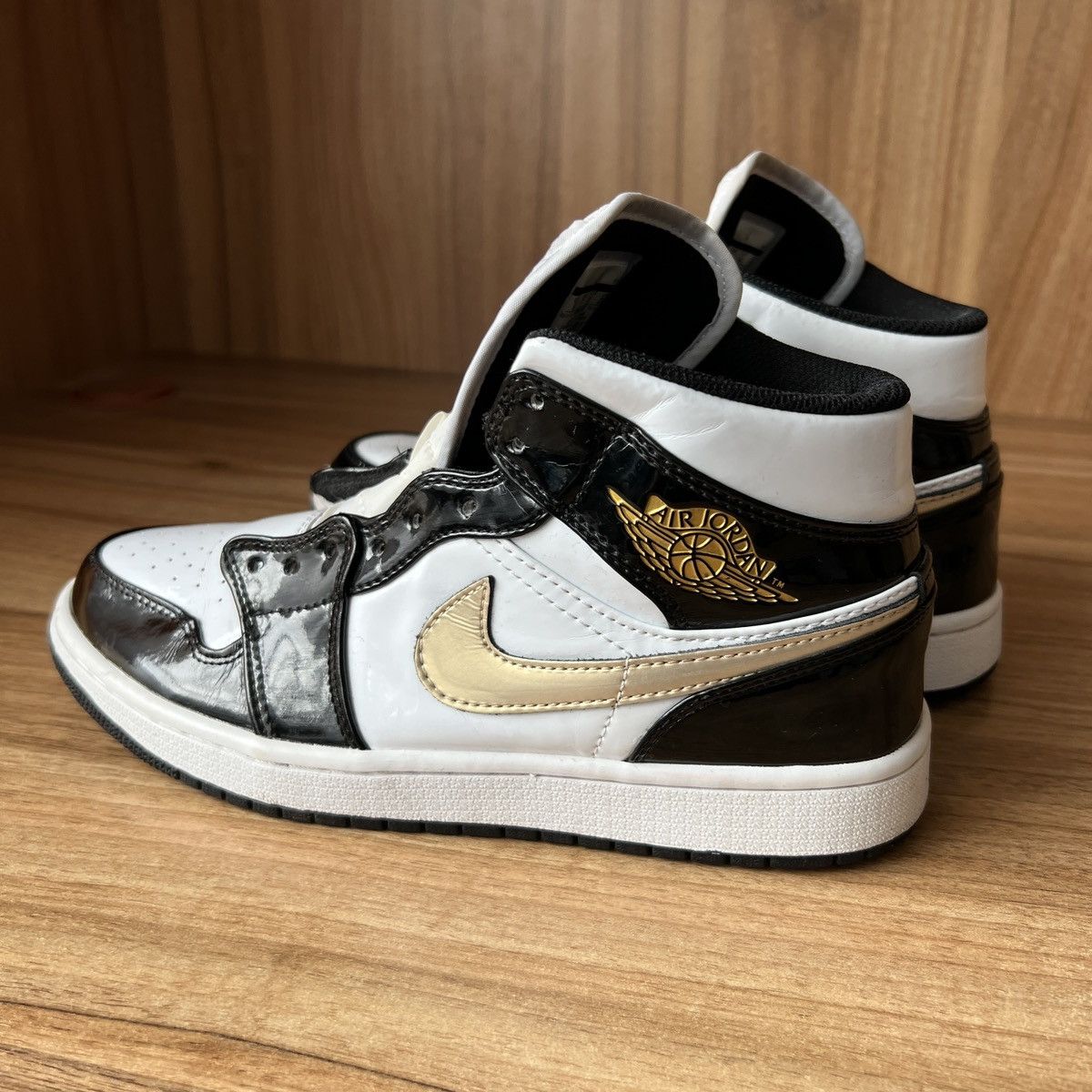 Air Jordan Mid Patent Black Gold