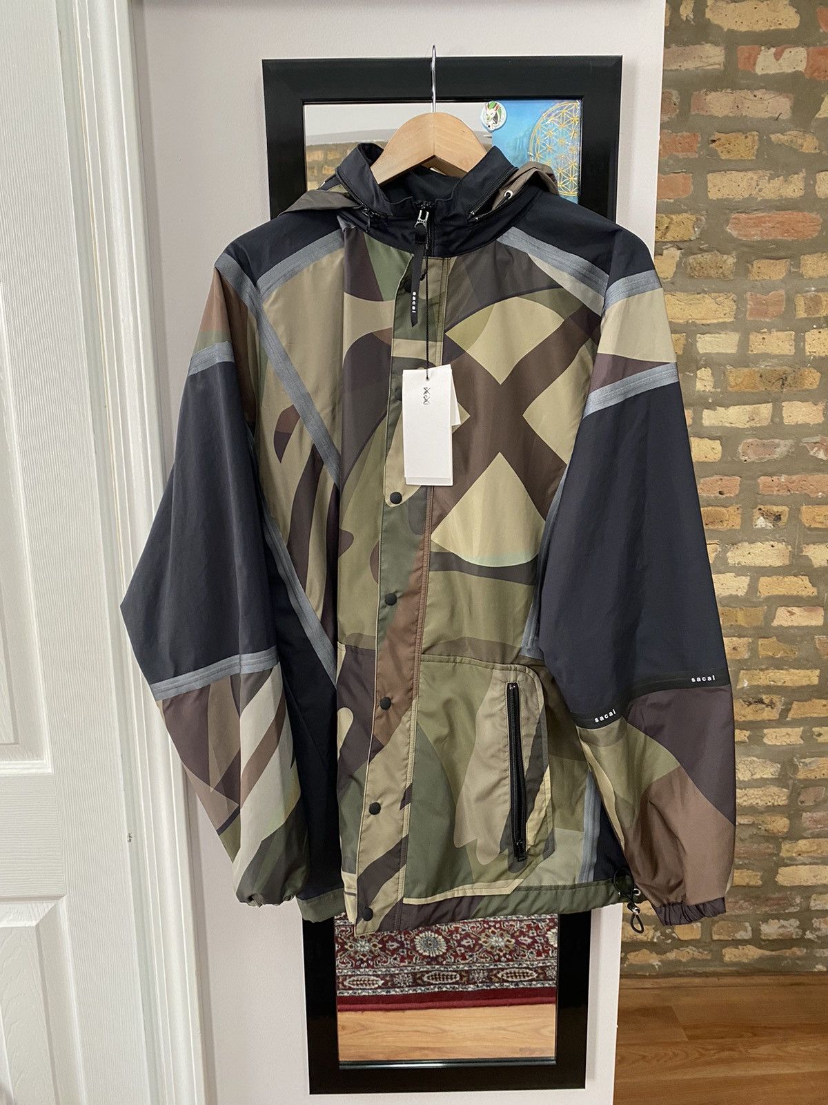 Kaws × Sacai Sacai x Kaws Packable Hood Jacket | Grailed