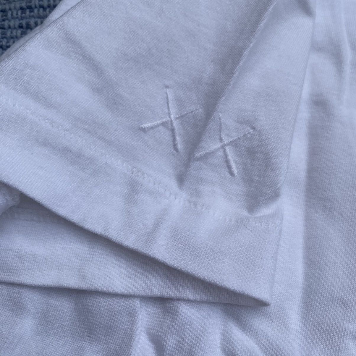 Kaws × Uniqlo pocket tee Size US M / EU 48-50 / 2 - 8 Thumbnail