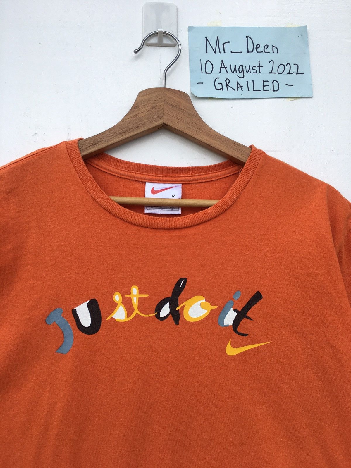 image of Nike Just Do It Spellout Tshirt in Orange, Men's (Size Medium)