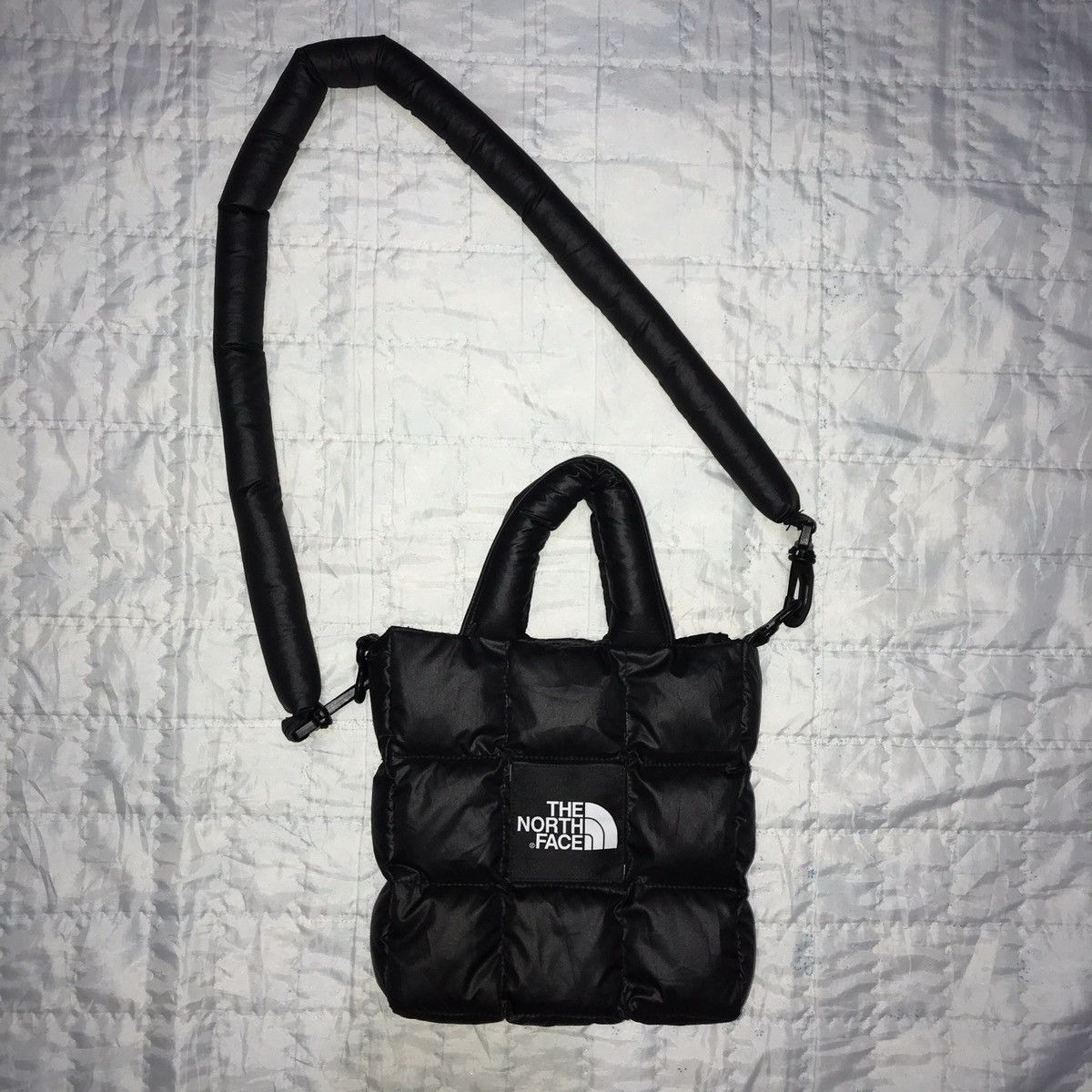 The North Face REWORKED The North Face Puffer Sling Bag Grailed