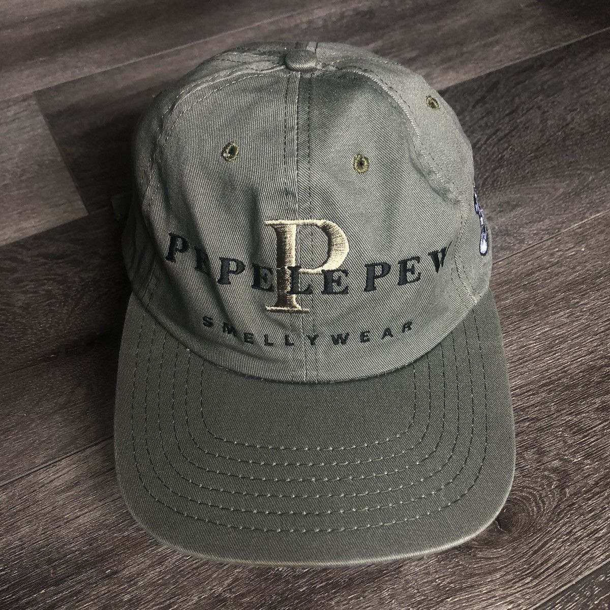 Vintage × Warner Bros Vintage 1990s Pepe Le Pew Smellywear Looney Tunes Logo Hat Size ONE SIZE - 1 Thumbnail