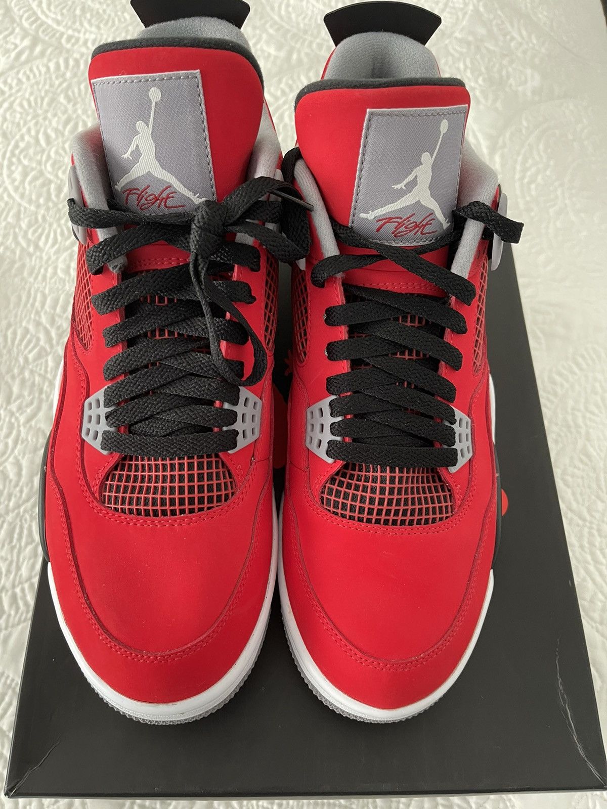 toro bravo jordan 4 red