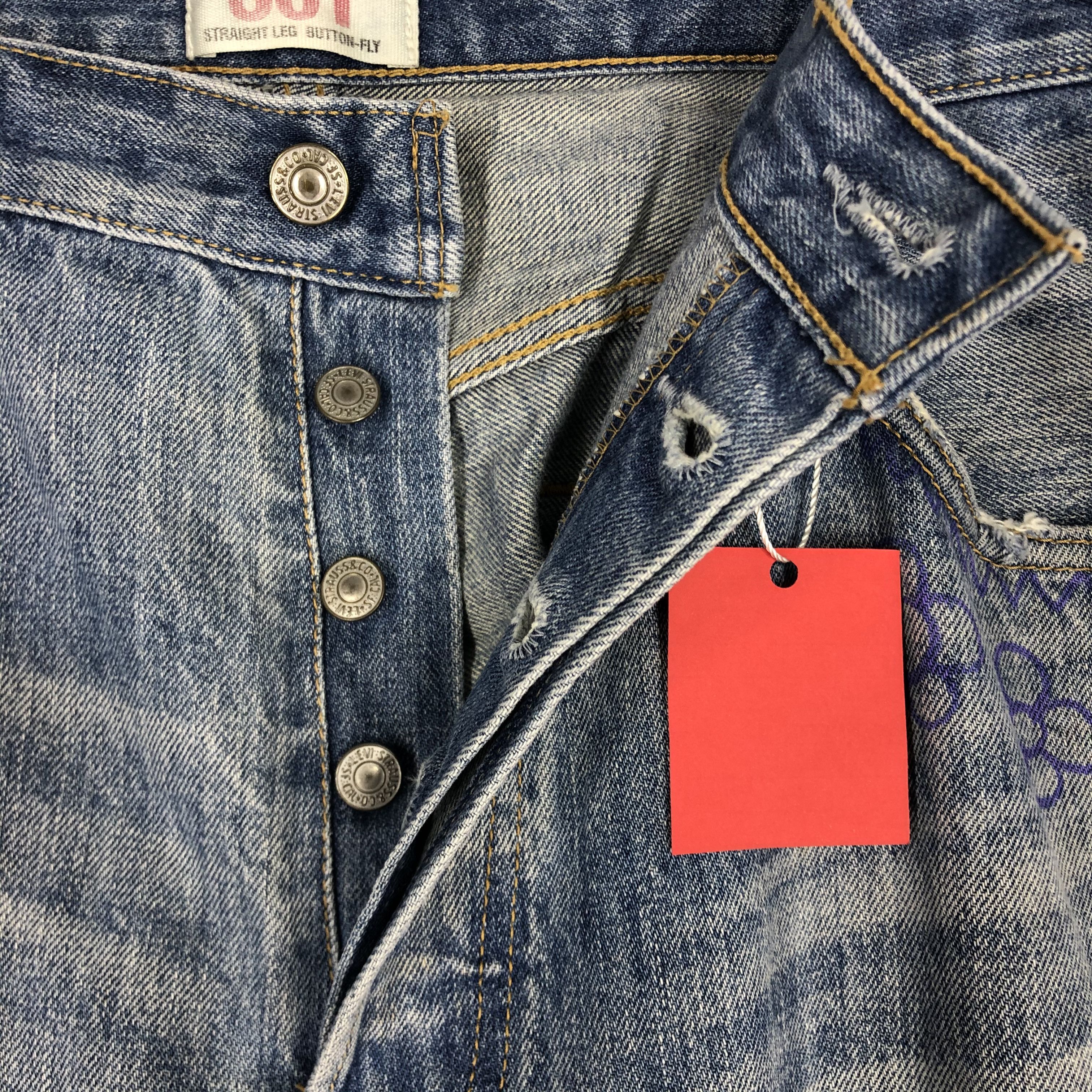 Distressed Levi's 501 Light Blue Jean Ripped Jean Size 36