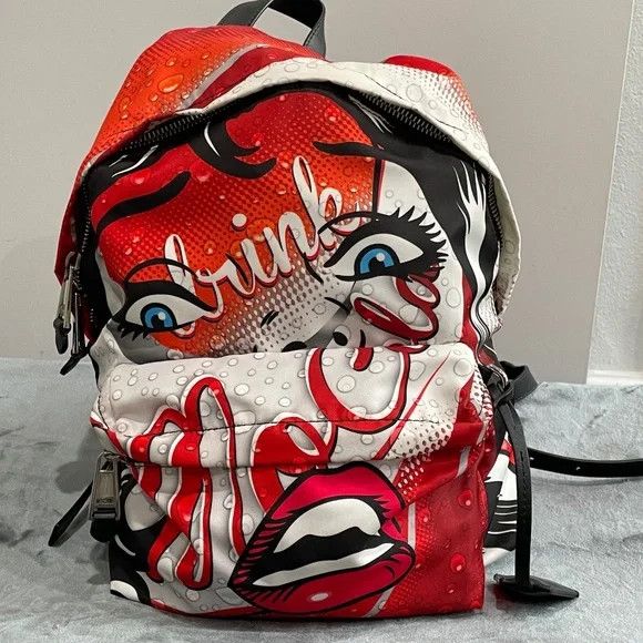 Jeremy Scott × Moschino MOSCHINO Milano Drink Coca-Cola Eyes Print Backpack Size ONE SIZE - 1 Thumbnail