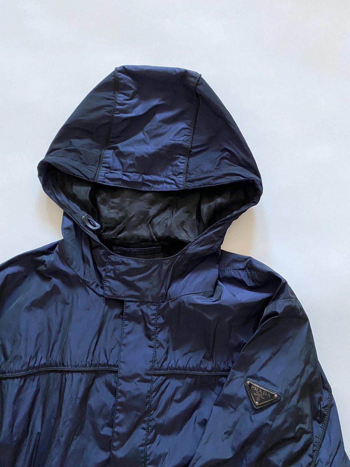 Prada Prada Mainline Triangle Metal Logo Nylon Hooded Jacket Prada Prada Mainline Triangle Metal Logo Nylon Hooded Jacket