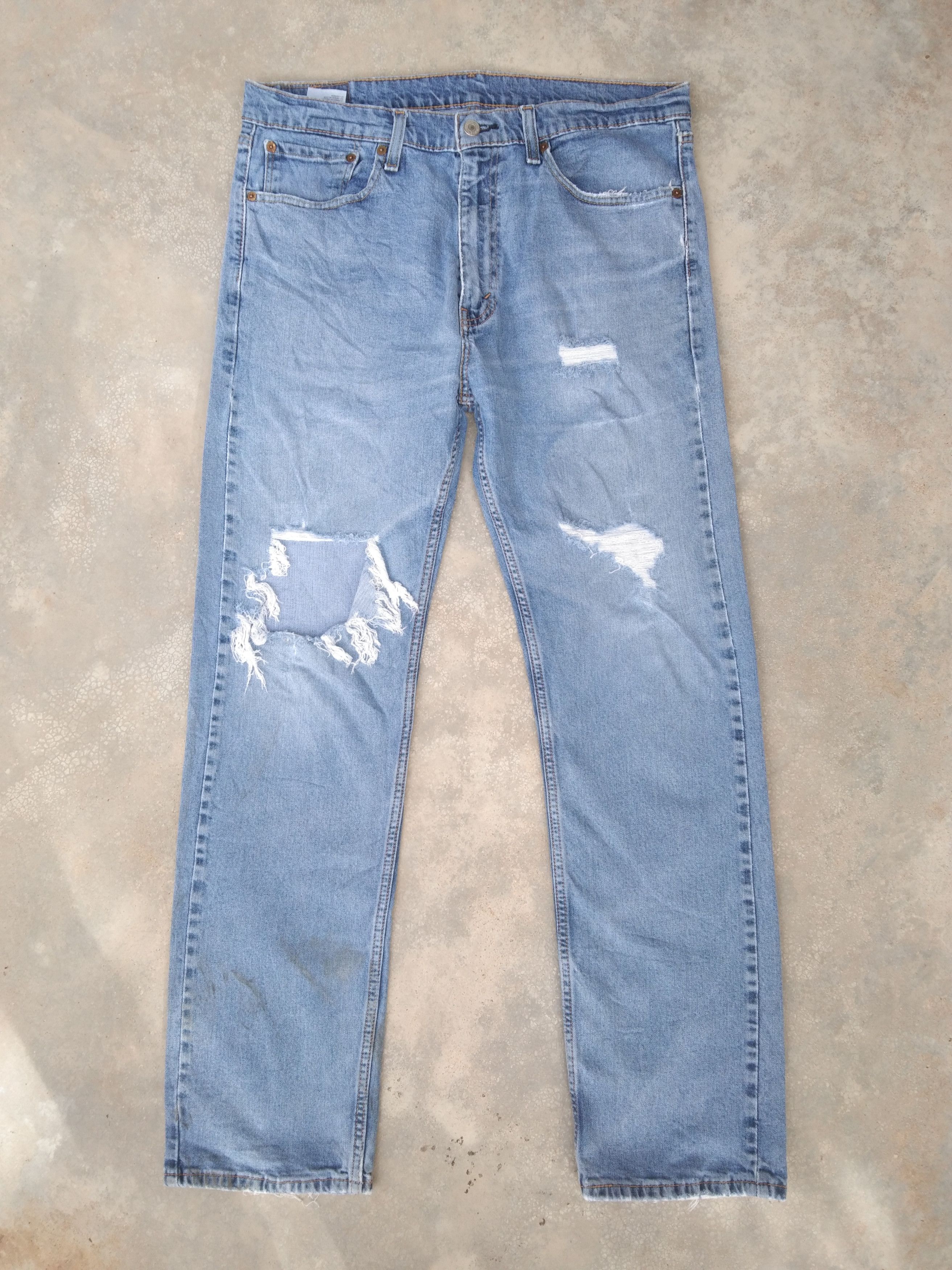 image of Vintage Levi's Jeans 505 Light Wash Ripped Distressed Denim in Blue, Men's (Size 36)