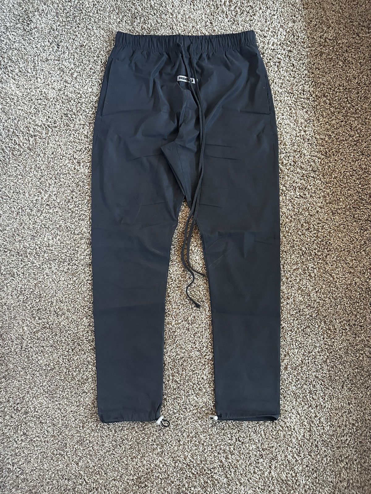 Fear of God fear of god essentials black reflective track pants Grailed