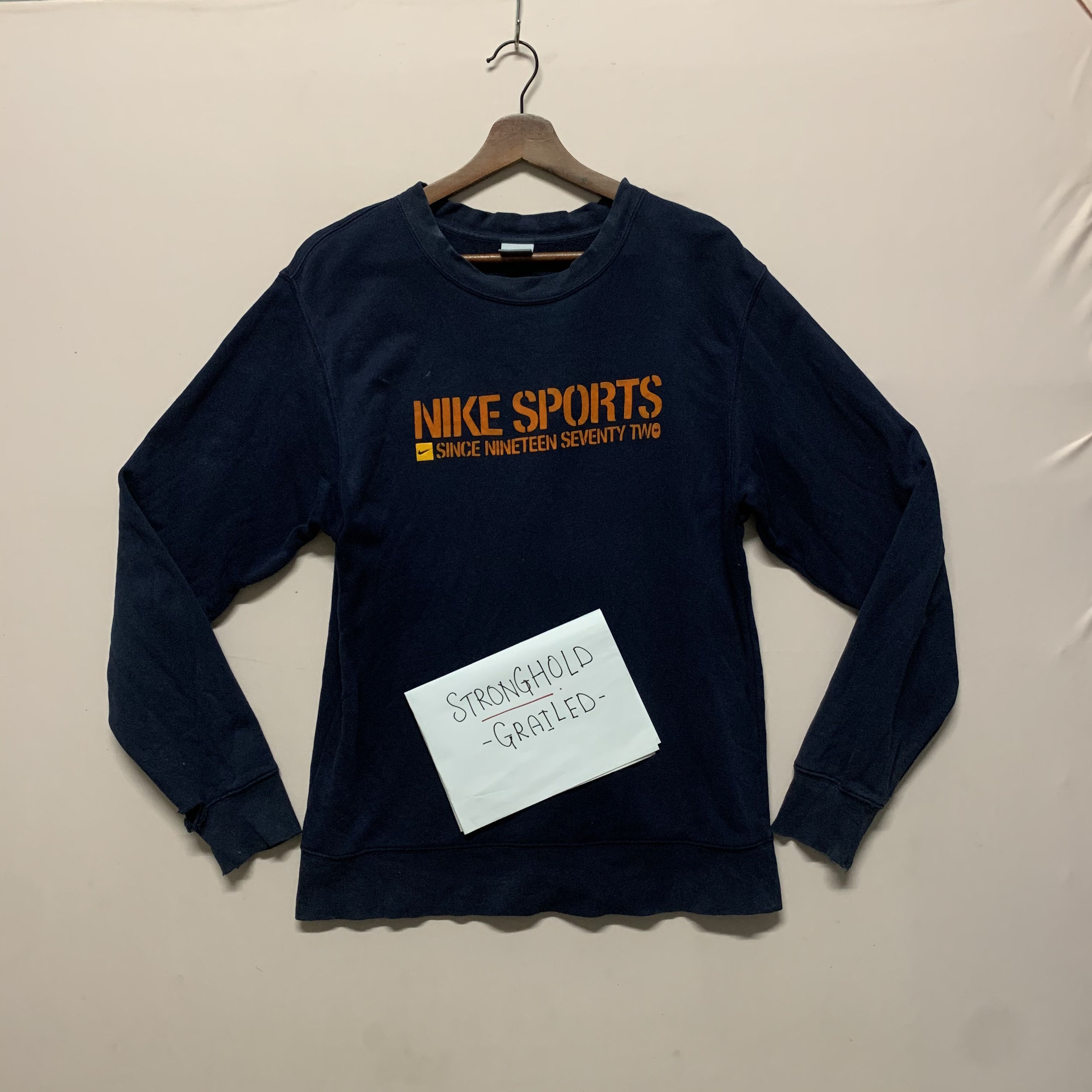 image of Nike Small Logo Sportswear Crewneck Sweatshirt in Navy Blue, Men's (Size Medium)