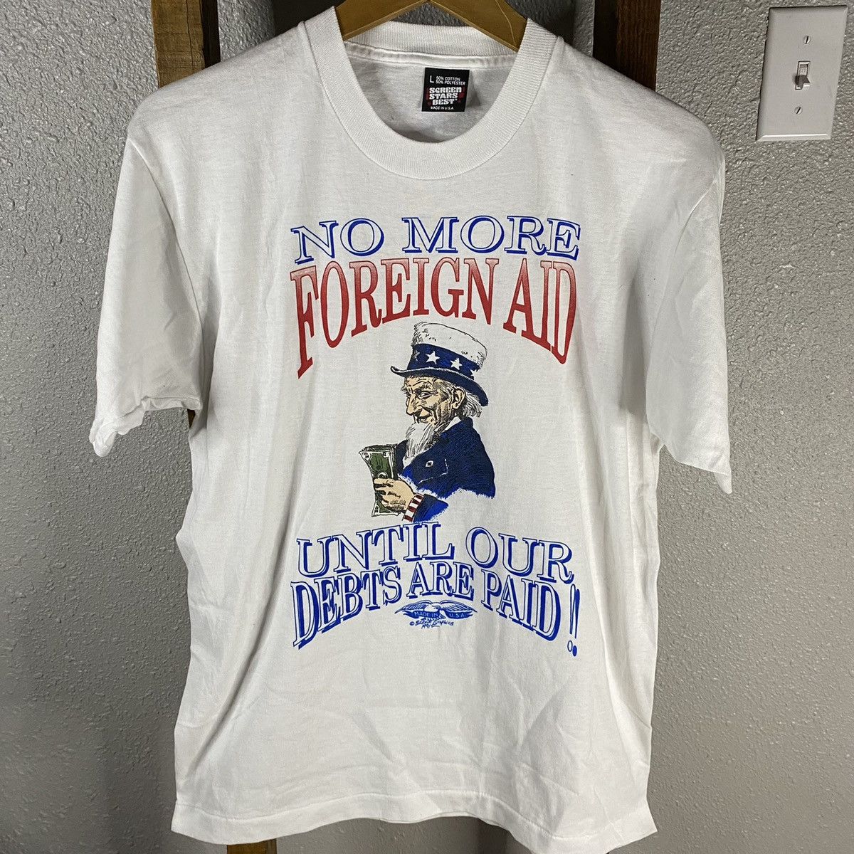 Vintage Vintage 1990s No More Foreign Aid tee | Grailed