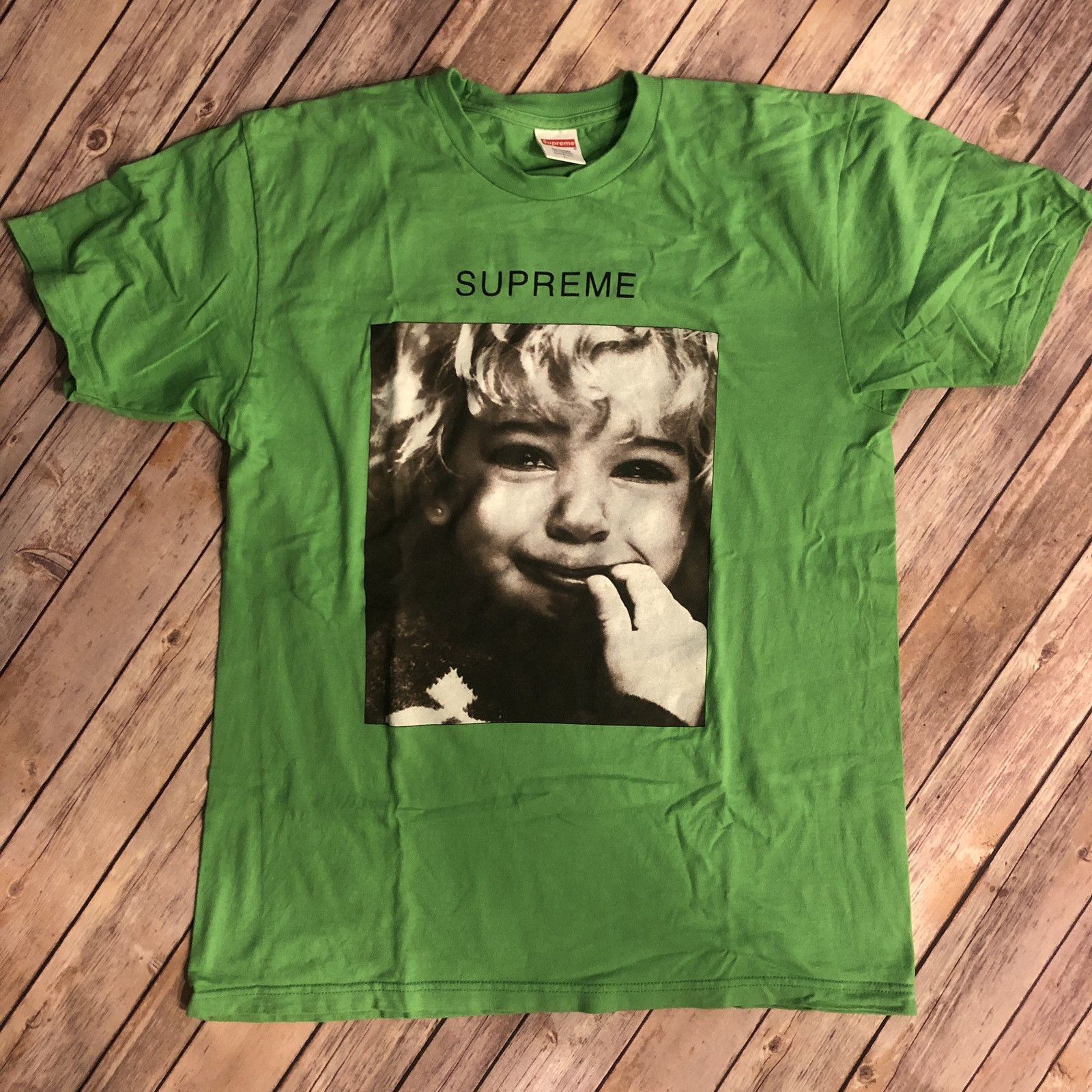 Supreme crying hot sale baby tee