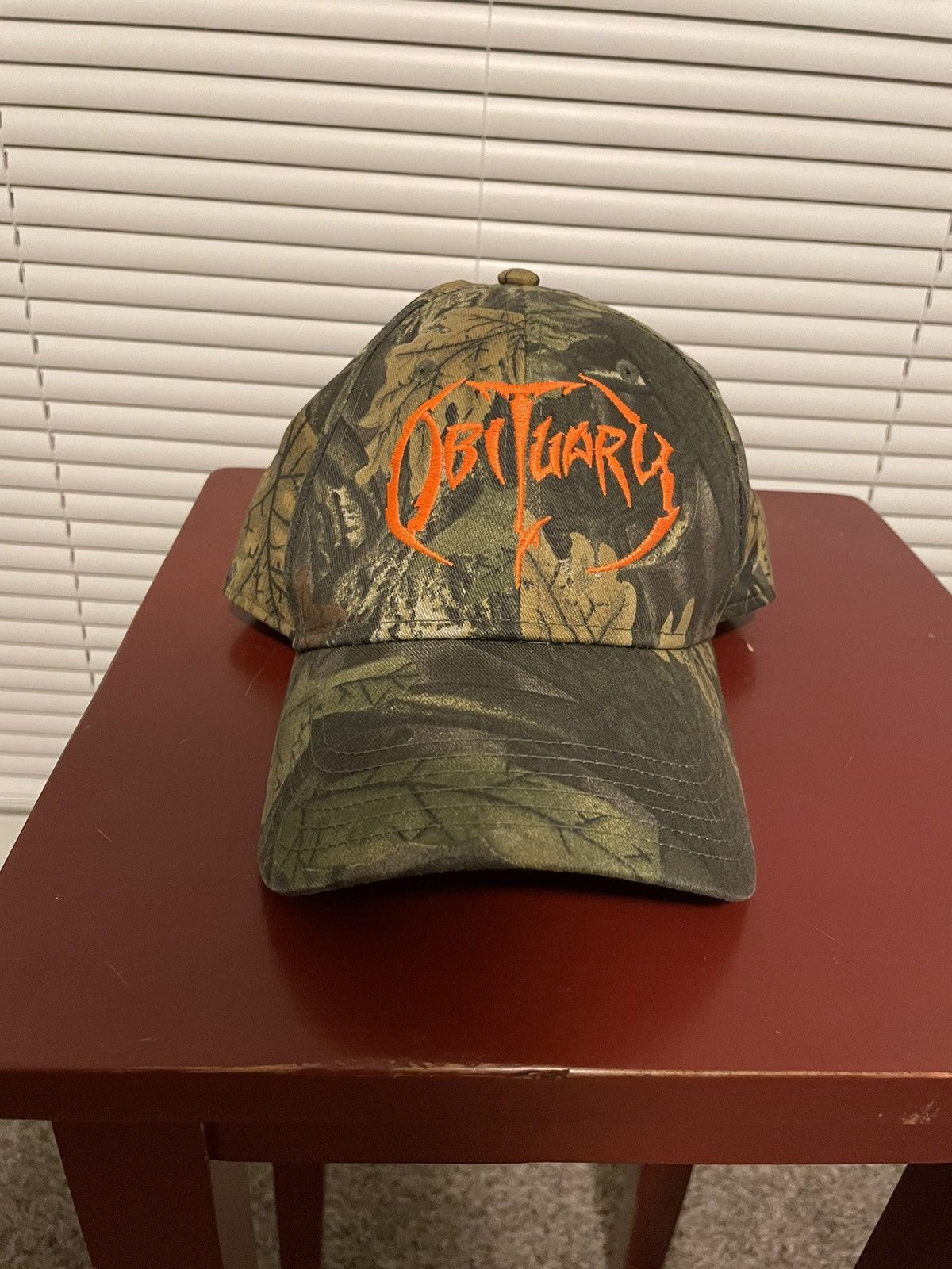 Obituary best sale camo hat