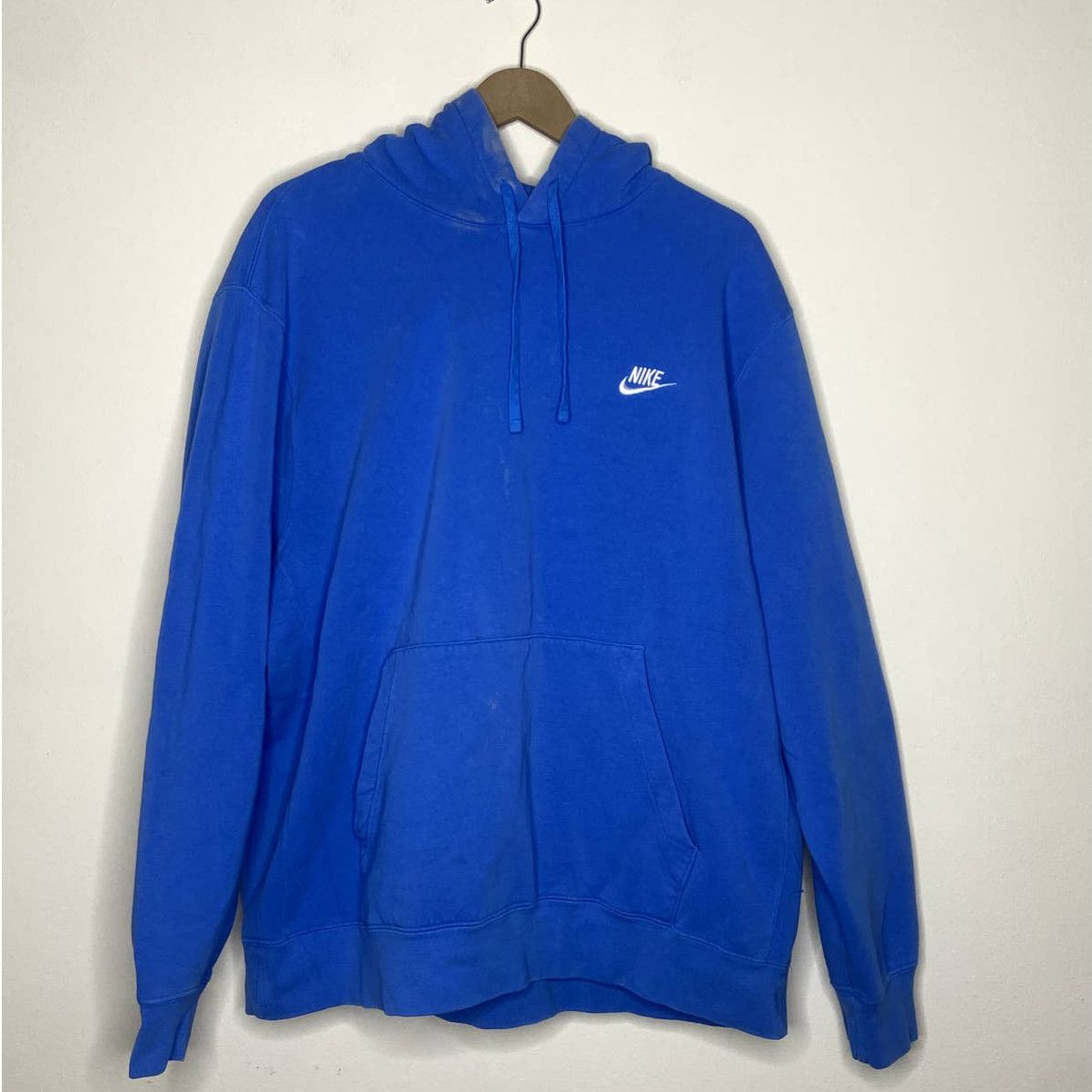 white nike hoodie with blue swoosh