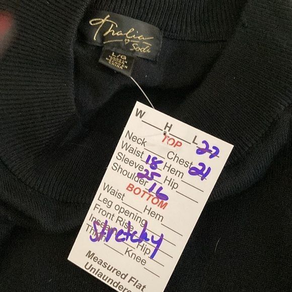 Black Thalia Sodi sweater with keyhole neck and peplum waist