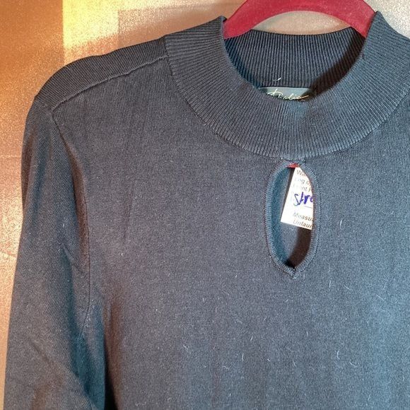 Black Thalia Sodi sweater with keyhole neck and peplum waist