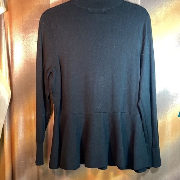 Black Thalia Sodi sweater with keyhole neck and peplum waist