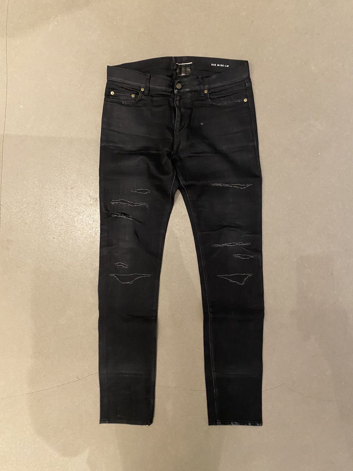 image of Saint Laurent Paris Slp D02 Distressed Denim in Black, Men's (Size 32)