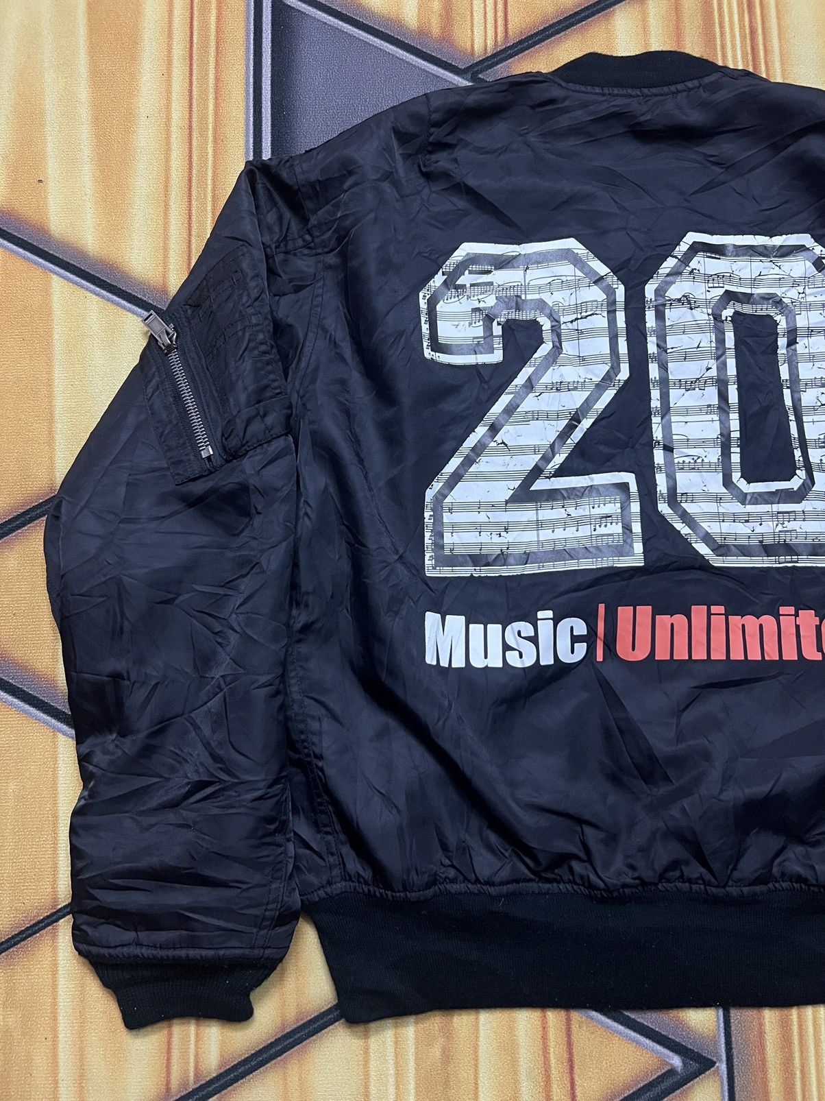 Music Unlimited Bomber Jacket by Christian Dada