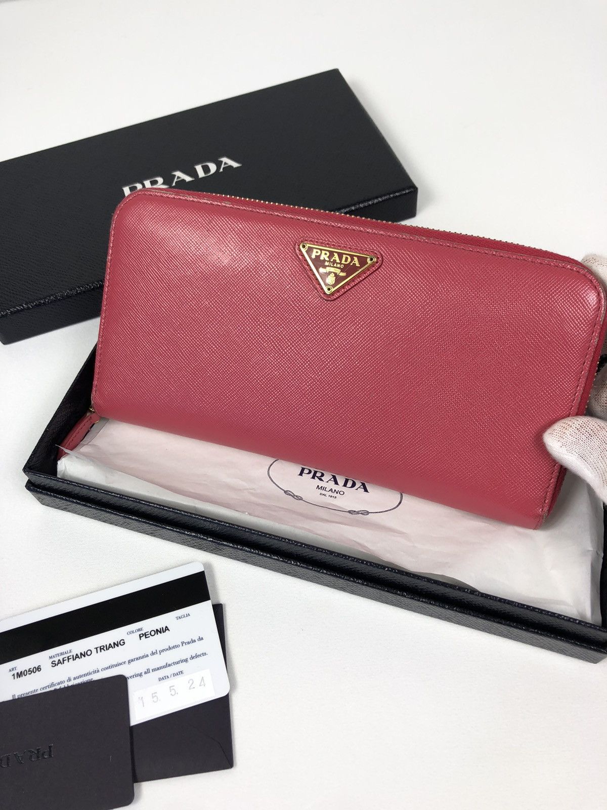 Prada saffiano triang leather zippy wallet