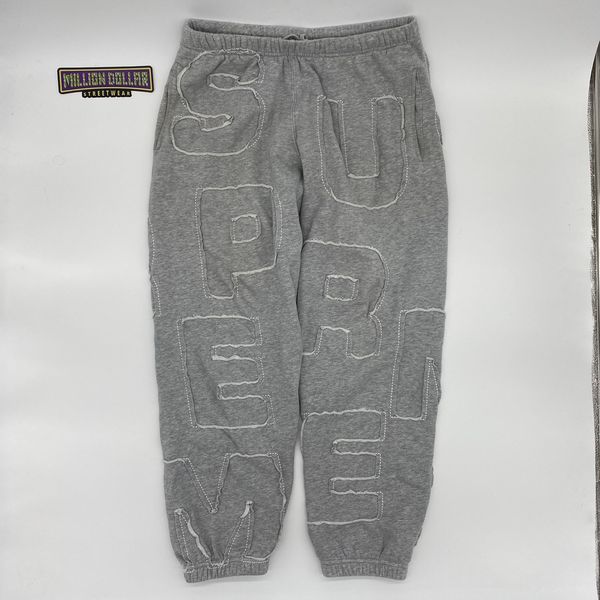 Supreme cutout best sale letters sweatpants