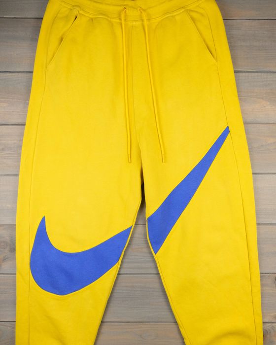 Nike Nike yellow sweatpants/joggers big swoosh Grailed