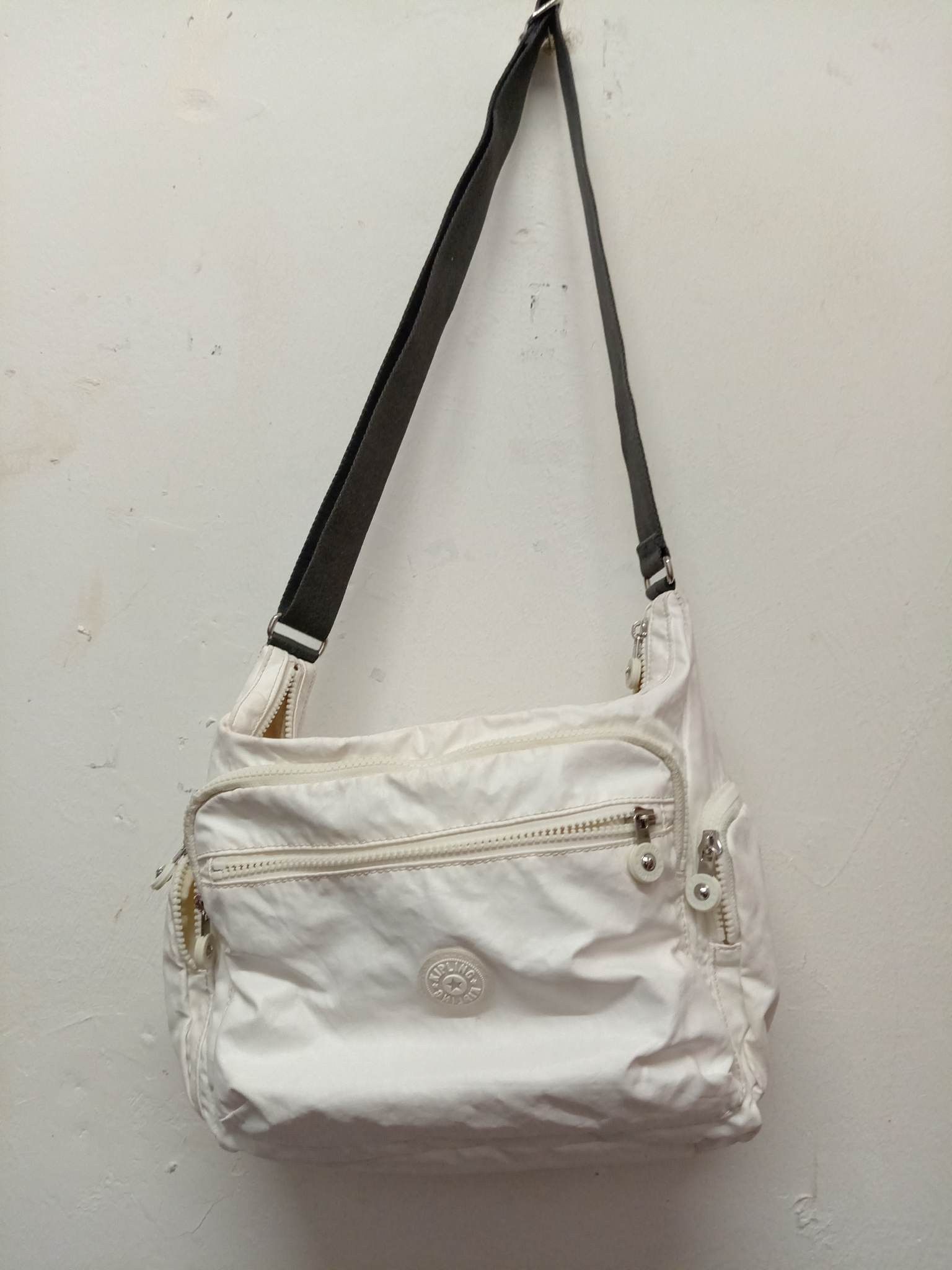 Kipling multi pocket sling bag