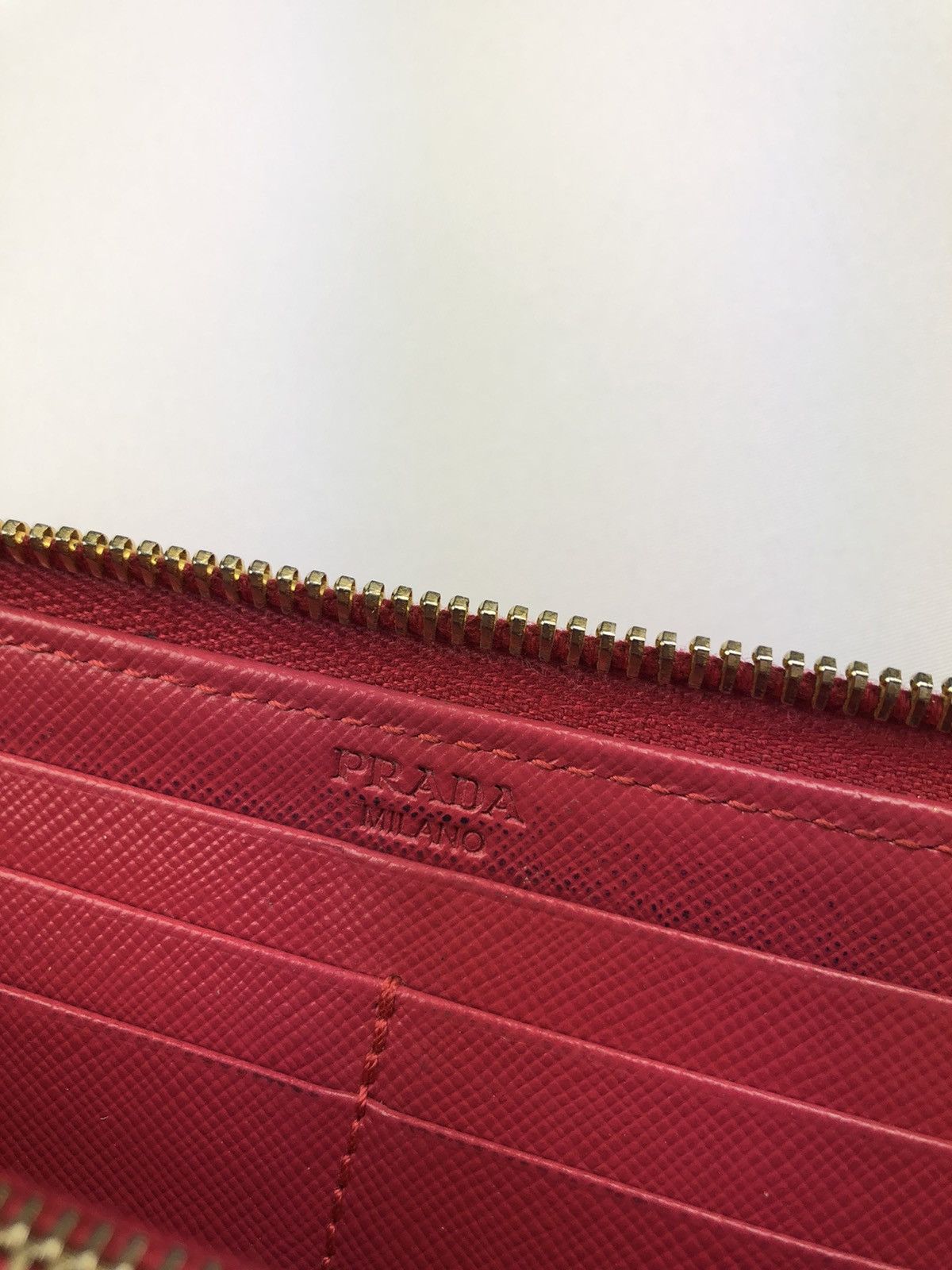 Prada saffiano metal leather zippy wallet